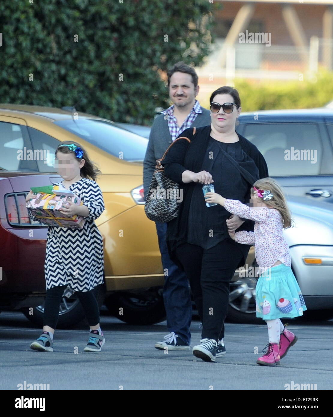 Melissa McCarthy and husband Ben Falcone take their daughters Vivian and Georgette to a birthday party at Pickwick Bowling Alley  Featuring: Melissa McCarthy,Ben Falcone,Vivian Falcone,Georgette Falcone Where: Burbank, California, United States When: 06 Dec 2014 Credit: Cousart/JFXimages/WENN.com Stock Photo