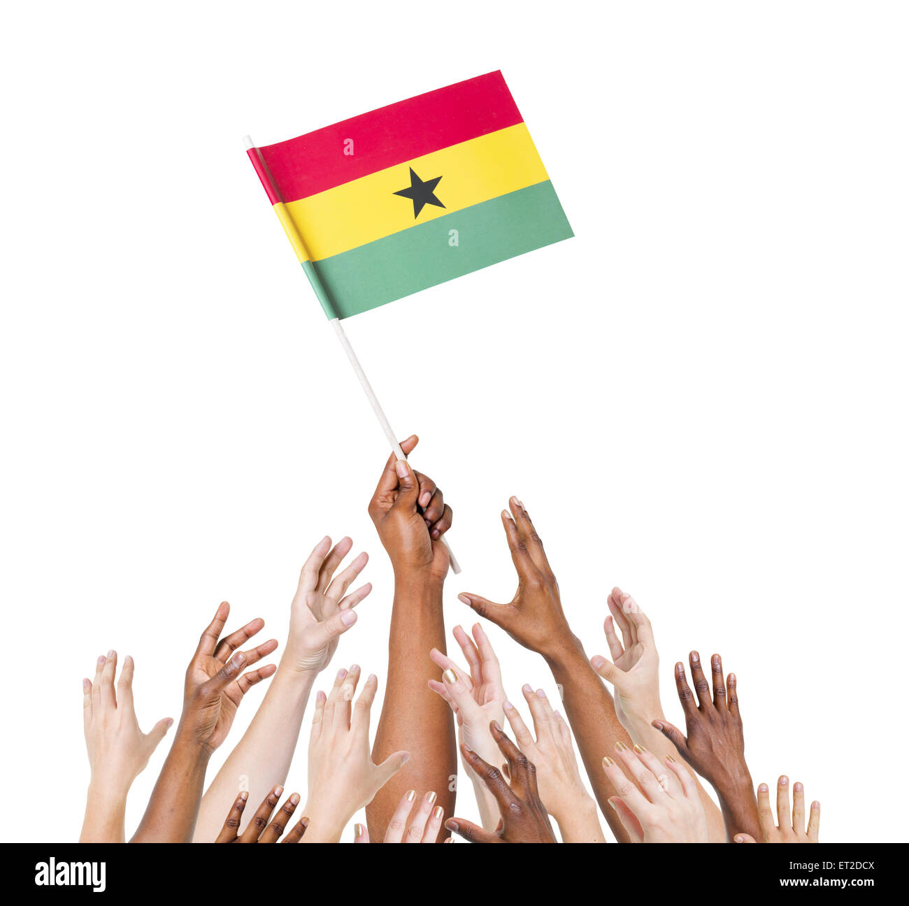 Group of multi-ethnic people reaching for and holding the flag of Ghana. Stock Photo