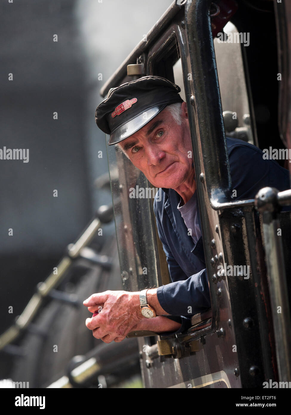 engine driver of a vintage steam locomotive at Loughborough station, on the Great Central Railway in Leicestershire,UK Stock Photo