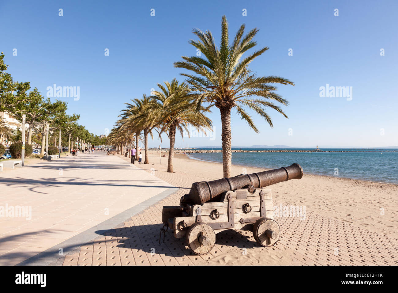 Old cannon on the waterfront promenade in Roses, Catalonia, Spain Stock Photo