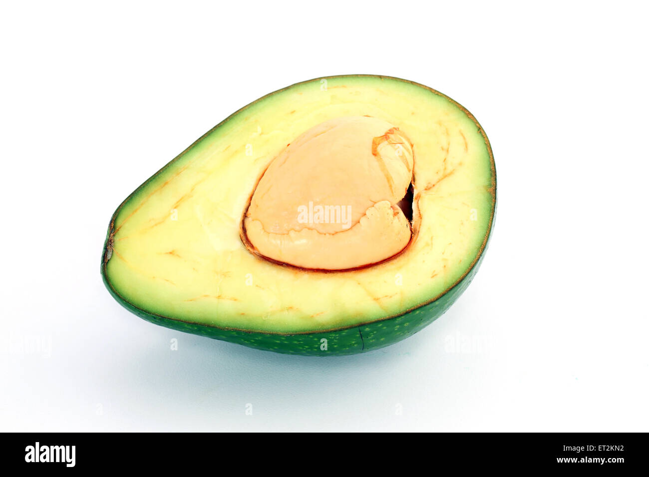 Avocado Cut In Half With The Pit On White Background Stock Photo Alamy Avocado Cut In Half With The Pit On White Background Stock Photo Alamy