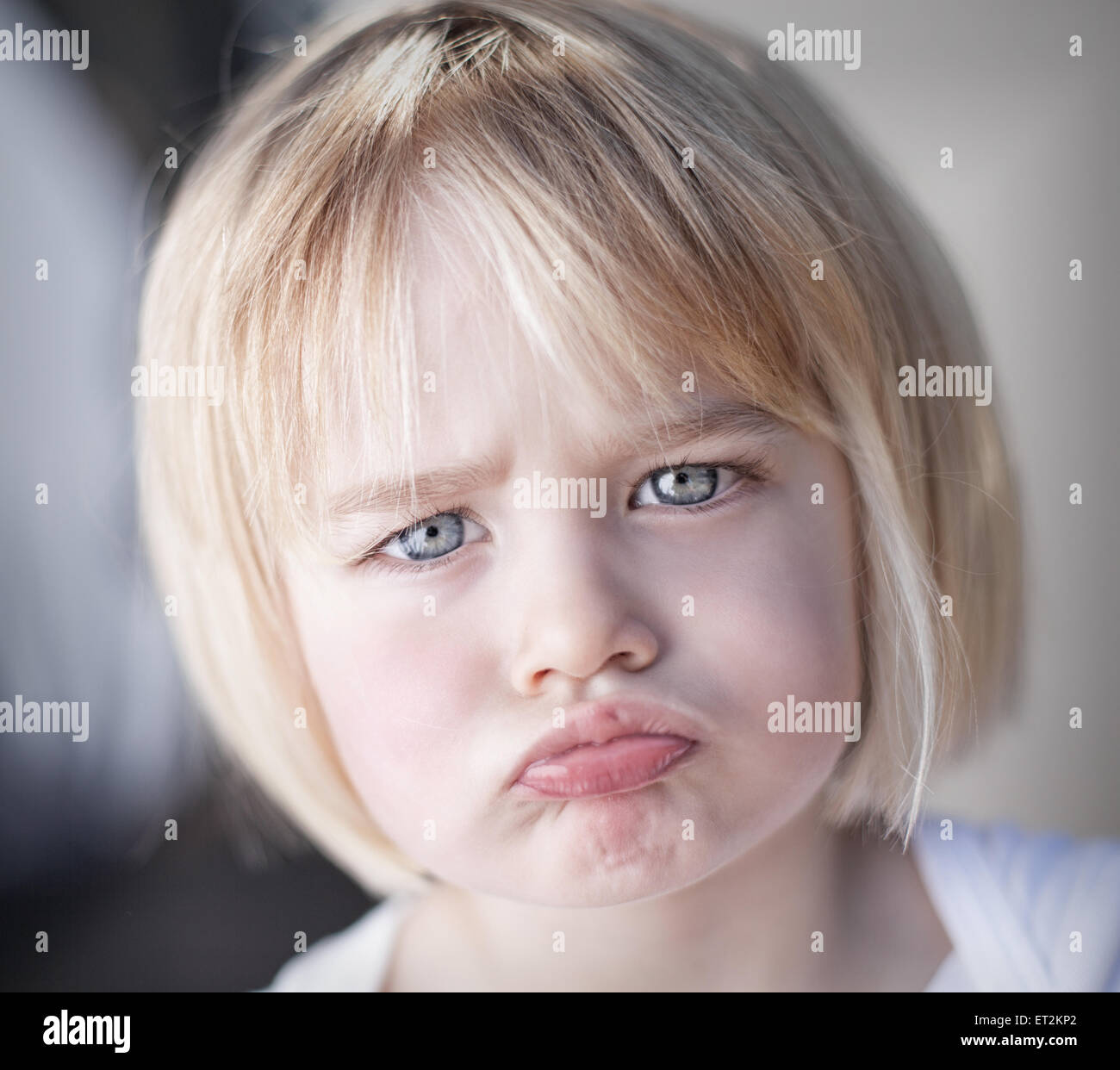 Portrait of an upset toddler girl Stock Photo