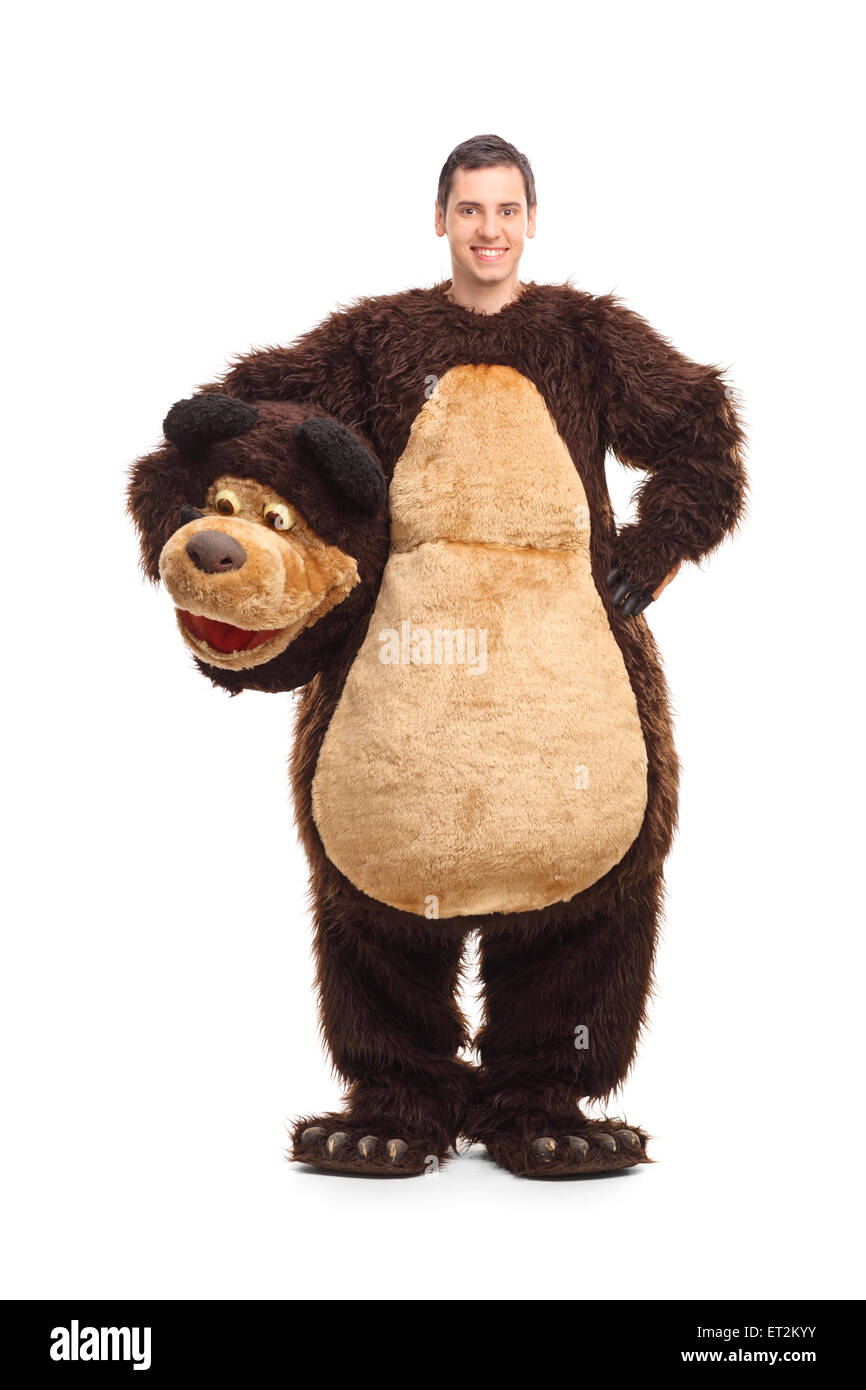 Full length portrait of a young man in a bear costume smiling and looking at the camera isolated on white background Stock Photo