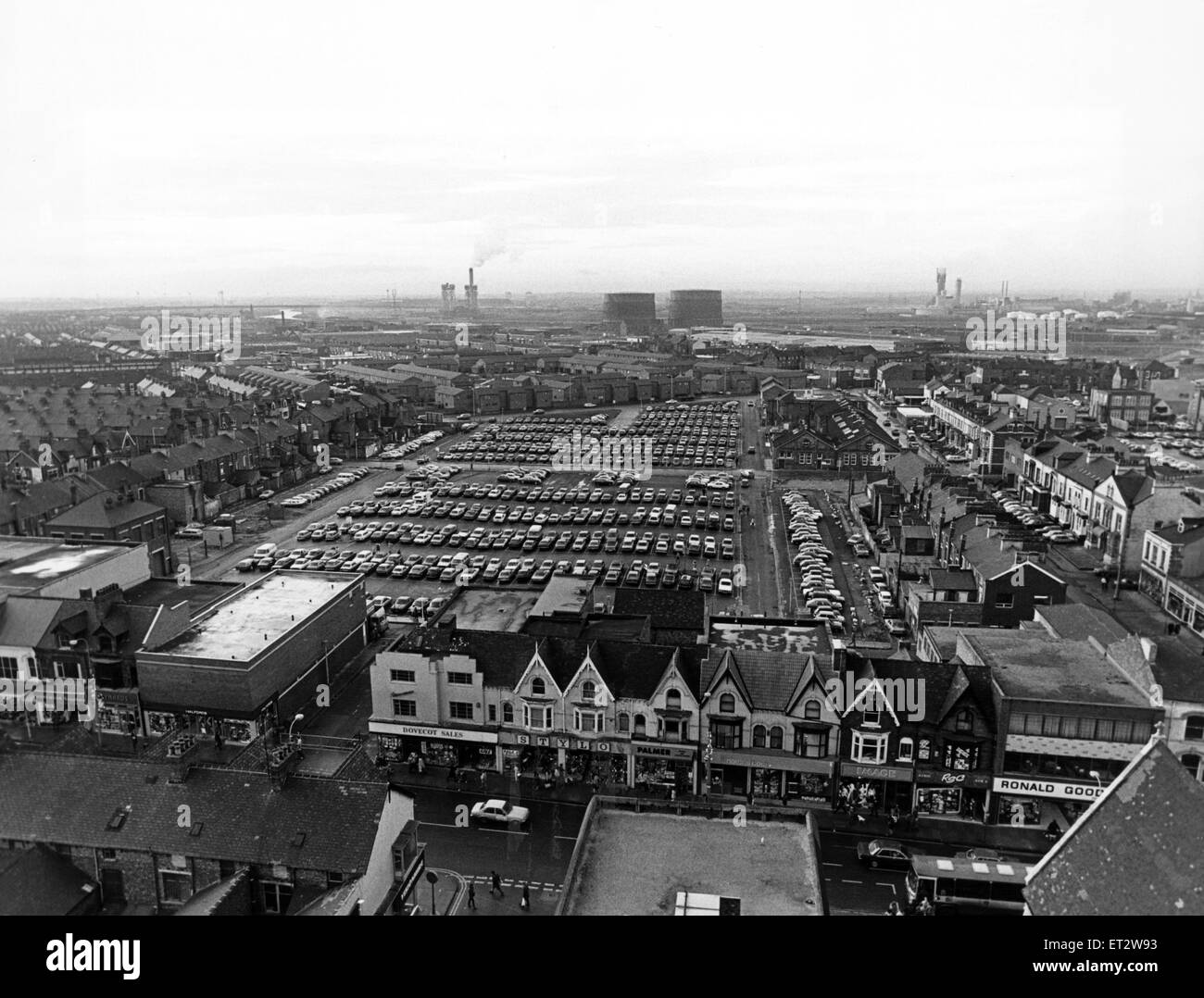 Aerial view of Middlesbrough, North Yorkshire. Five hundred cars parked in neat row dominate this bird's eye view from Church House in Central Middlesbrough. In the foreground: Linthorpe Road shops, while in the background are three industrial landmarks. Stock Photo