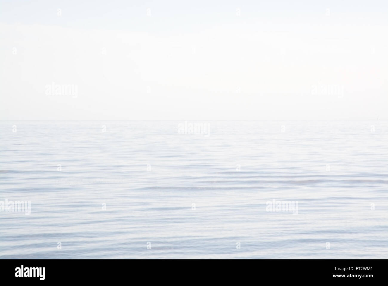 Blurry sea and sky background in Falkenberg, Sweden in afternoon sunlight. Stock Photo