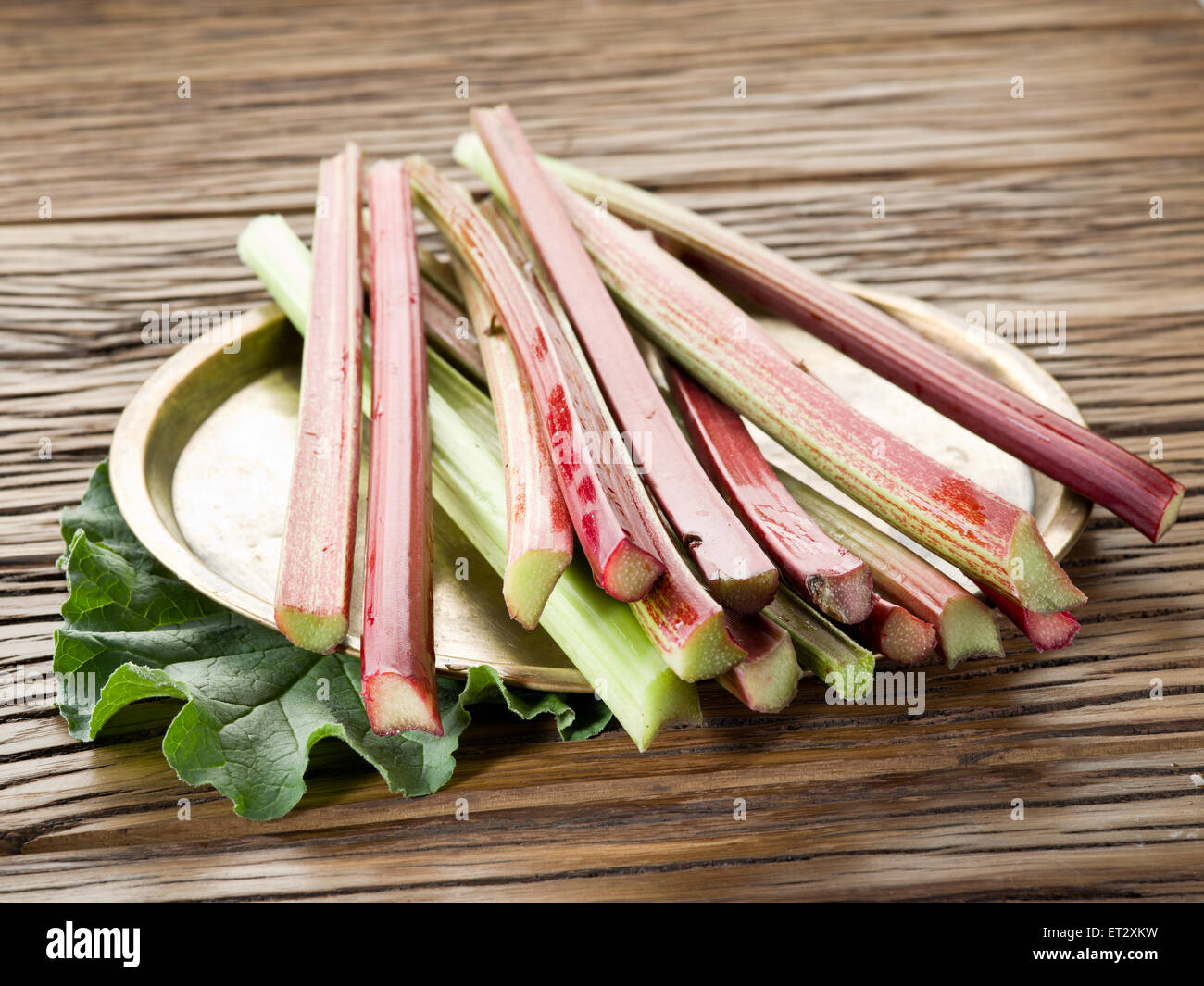 Rhubarb stalks on the wooden table. Stock Photo