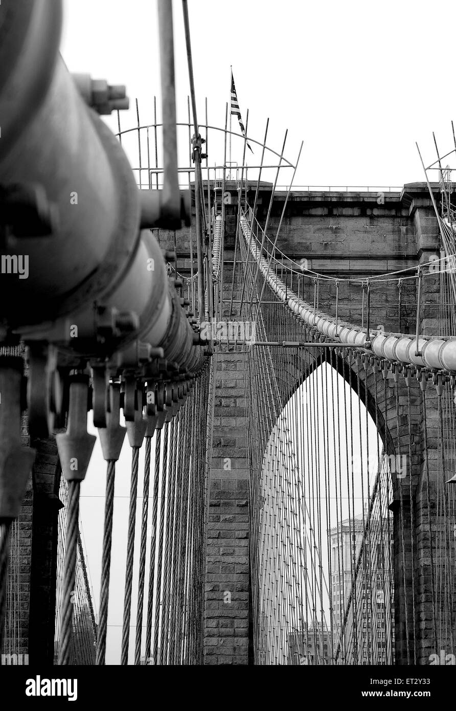 The Brooklyn Bridge spanning the East River from Manhattan to Brooklyn. The Bridge is a hybrid cable-stayed suspension bridge in New York City, USA Stock Photo