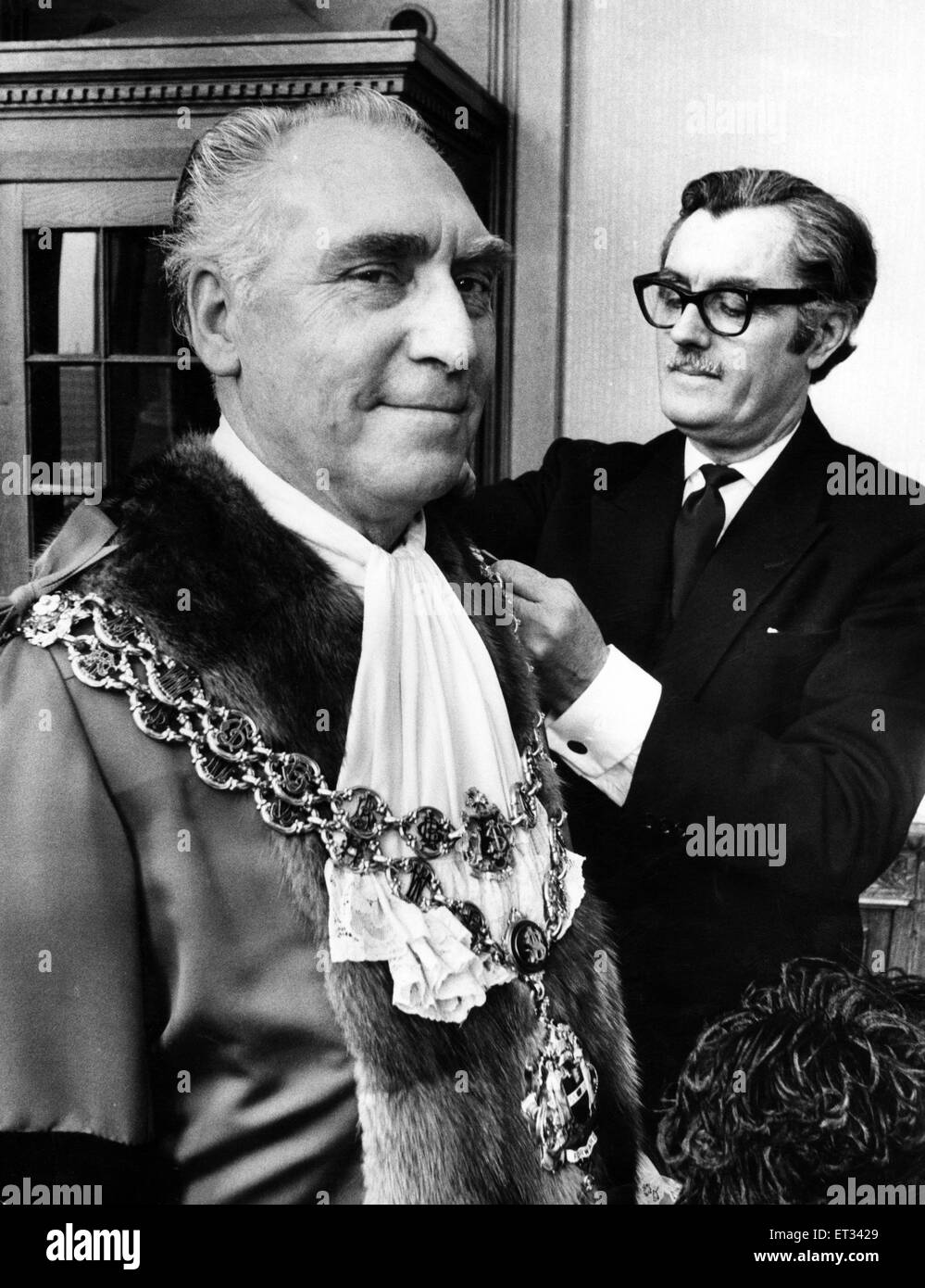 Councillor James Eames being robed by his attendant Mr. Tom Freer before being elected Lord Mayor of Birmingham. Eames is a 57-year-old engine driver. 21st May 1974. Stock Photo