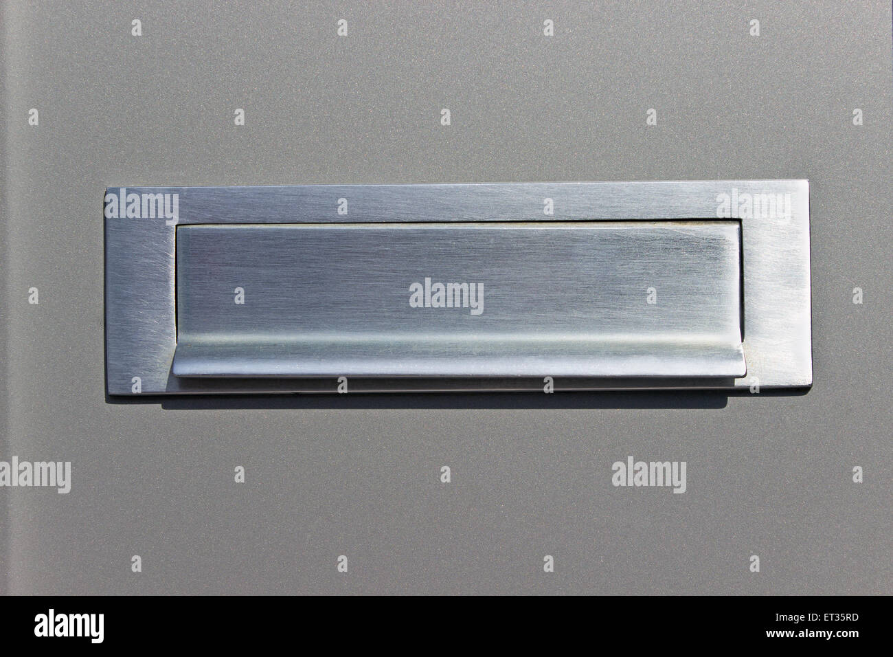 Mailslot on silver post box Stock Photo Alamy
