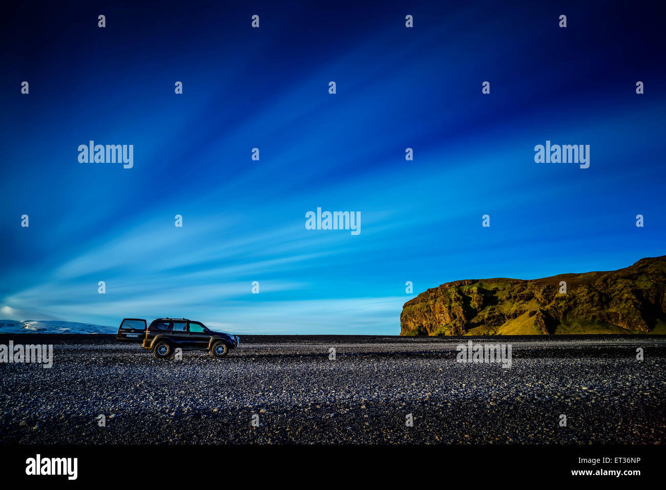 Jeep or SUV traveling on black sands, Dyrholaey, Iceland Stock Photo