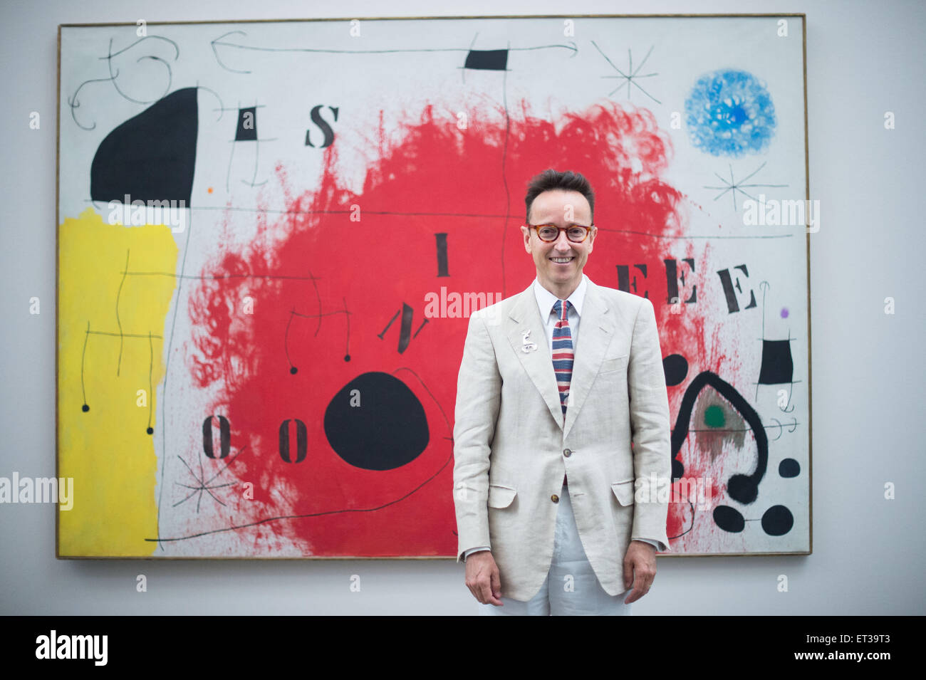 Duesseldorf, Germany. 11th June, 2015. Joan Punyet Miro, the grandson of the Catalan painter Miro (1893-1983), poses after a press conference in front of the painting 'Silence' (17. May 1968, oil on canvas) by Miro in the Kunstsammlung Nordrhein-Westfalen in Duesseldorf, Germany, 11 June 2015. The exhibition 'Miro. Painting as Poetry.' - which includes around 110 pieces from all periods of the artist's work - can be seen from 13 June to 27 September 2015 in K20. Photo: MAJA HITIJ/dpa/Alamy Live News Stock Photo