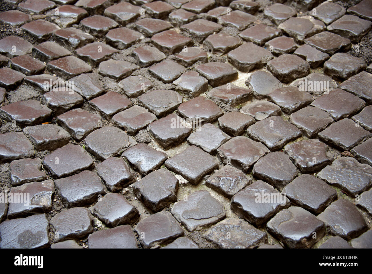 old cobblestone road as background Stock Photo - Alamy