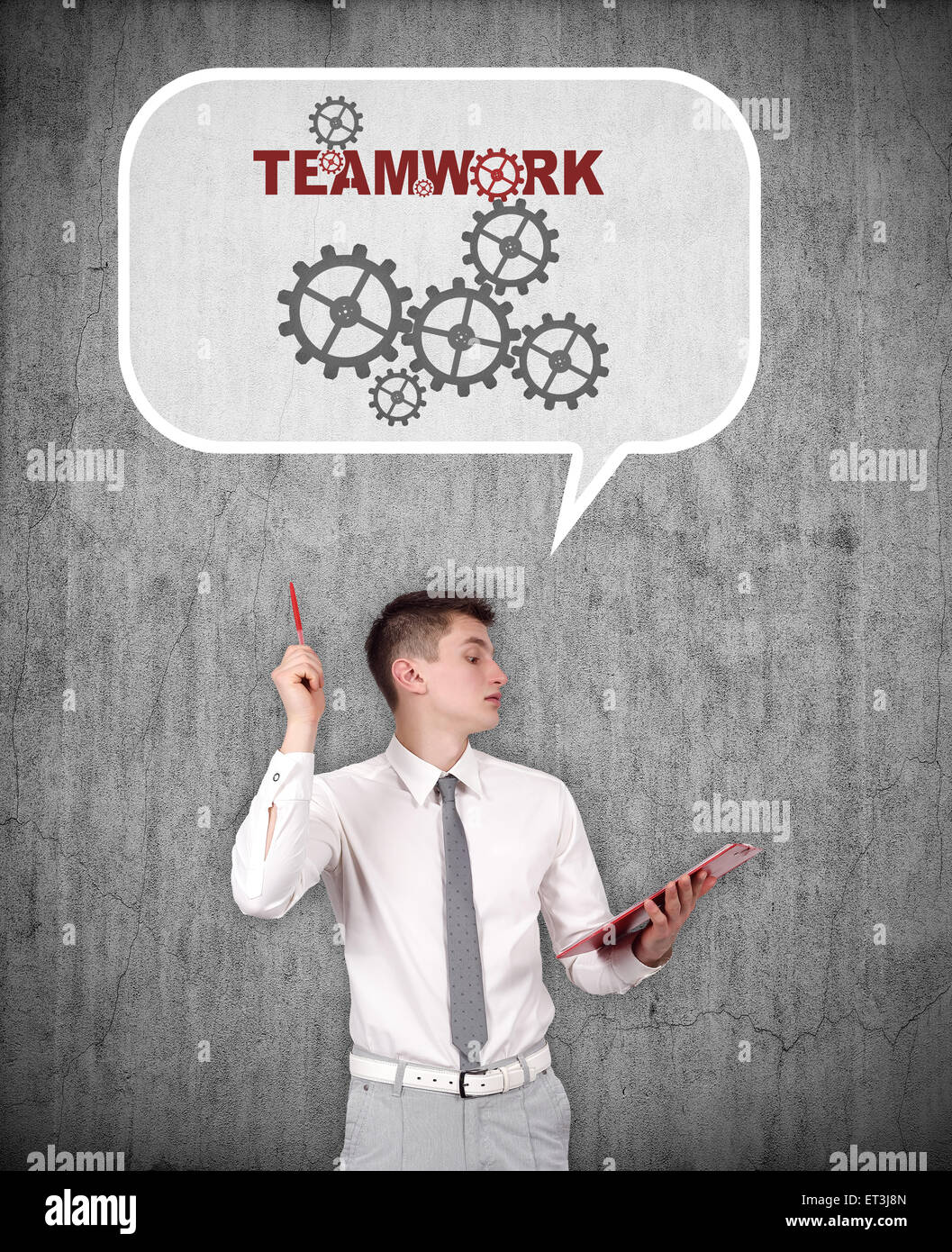 businessman thinking about teamwork on a gray background Stock Photo
