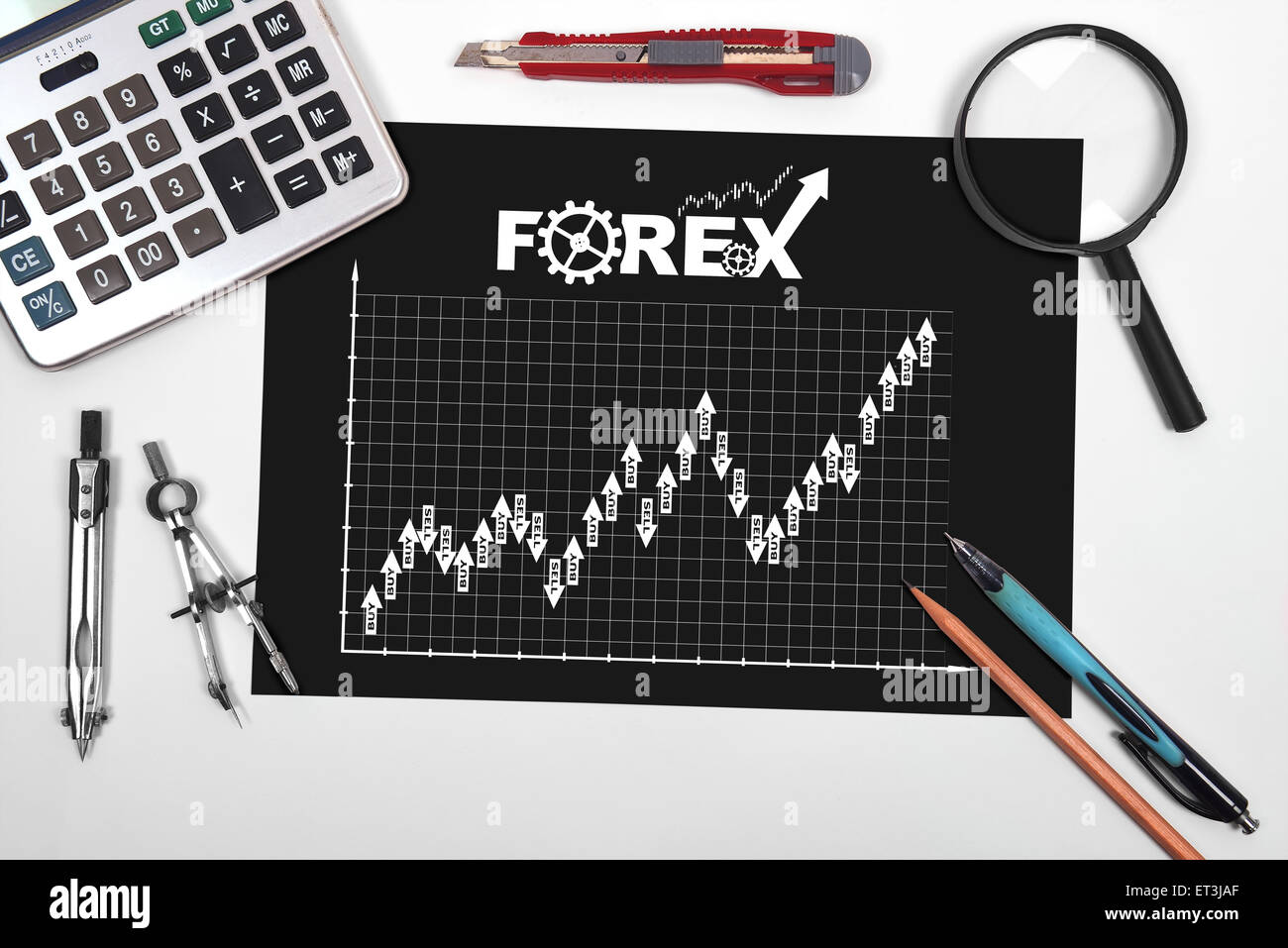 paper with stock chart and tools on desktop engineer Stock Photo - Alamy
