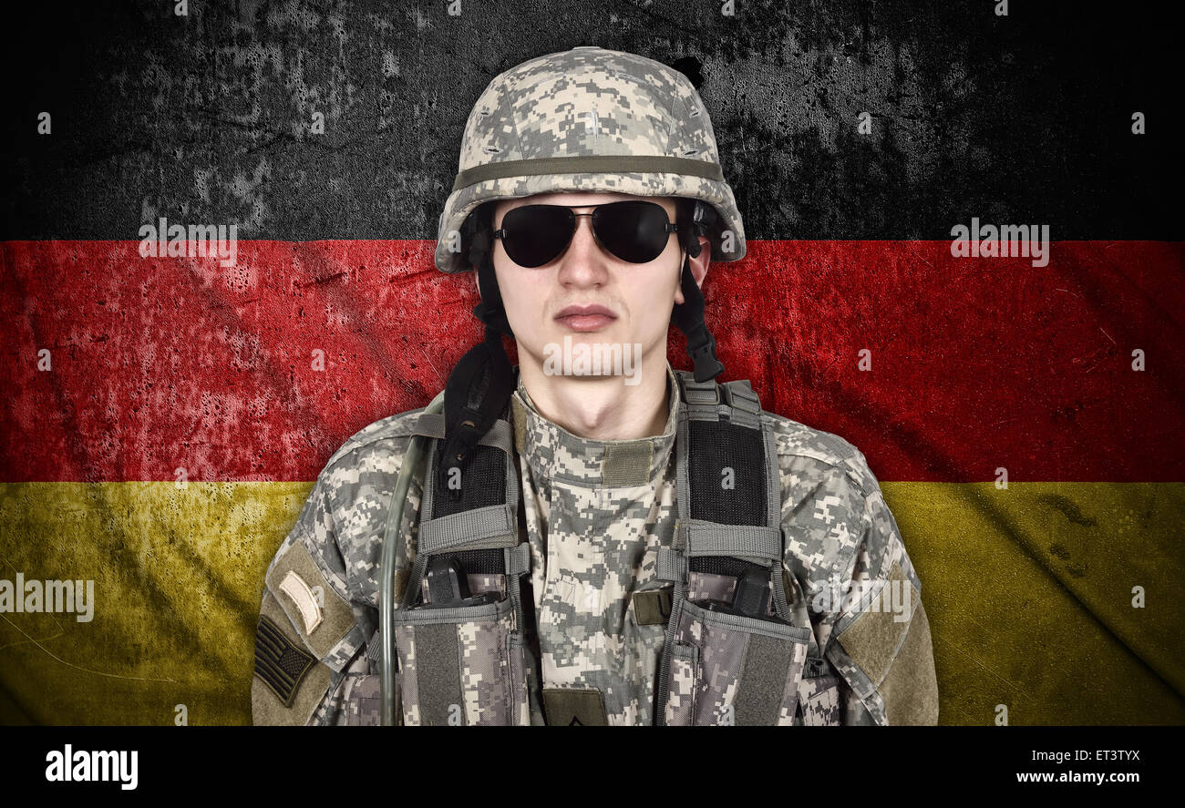 american soldier and Germany flag on background Stock Photo