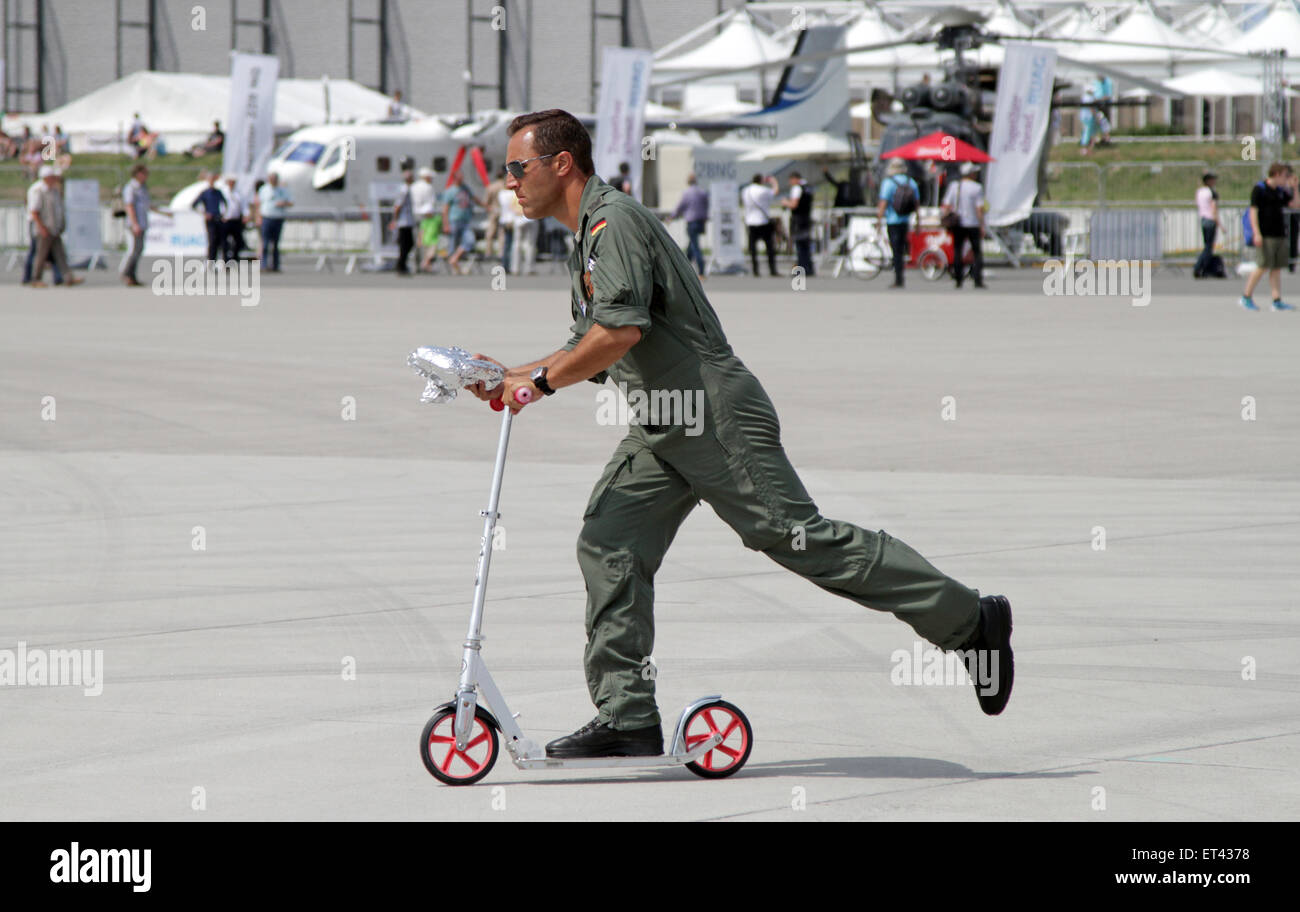 Schoenefeld, Germany, Bundeswehr soldier continues with a folding scooter Stock Photo