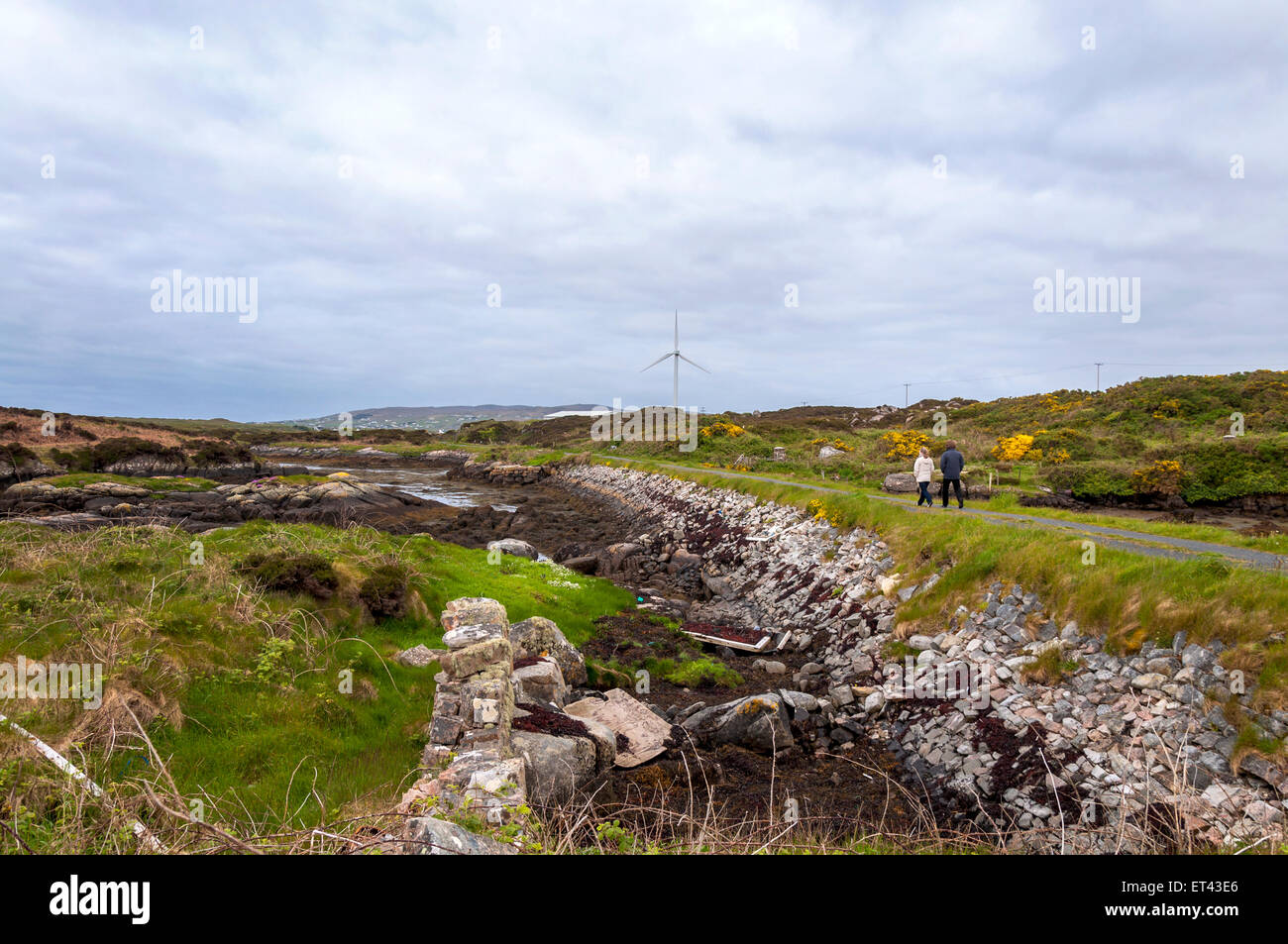 A couple walking on the Burtonport Railway Walk cycle path Donegal Ireland Stock Photo