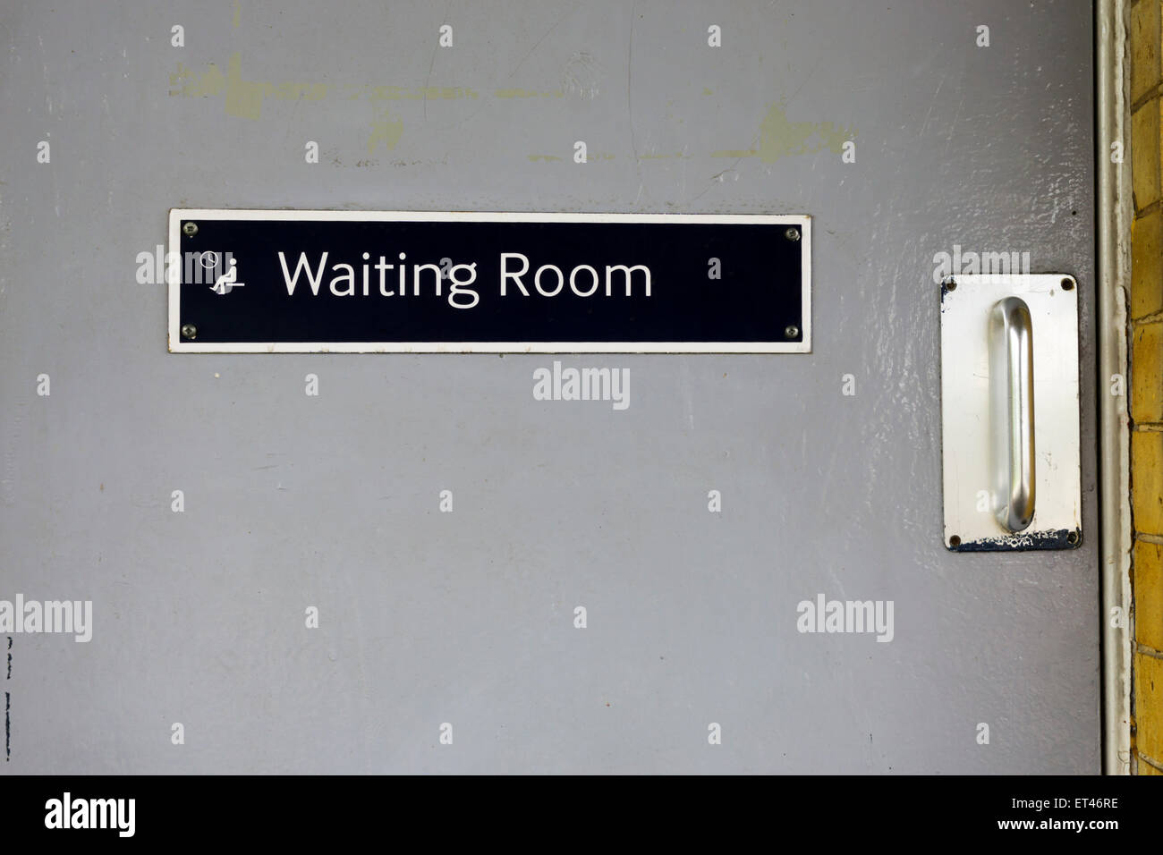 Sign on metal door to Waiting Room on railway station platform. Stock Photo