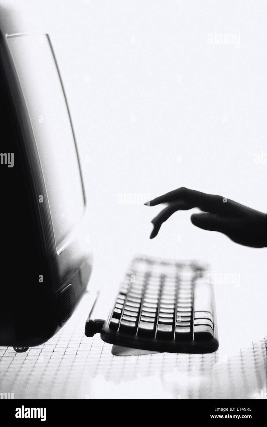 Hamburg, Germany, Hand typing on the keyboard of a computer Stock Photo