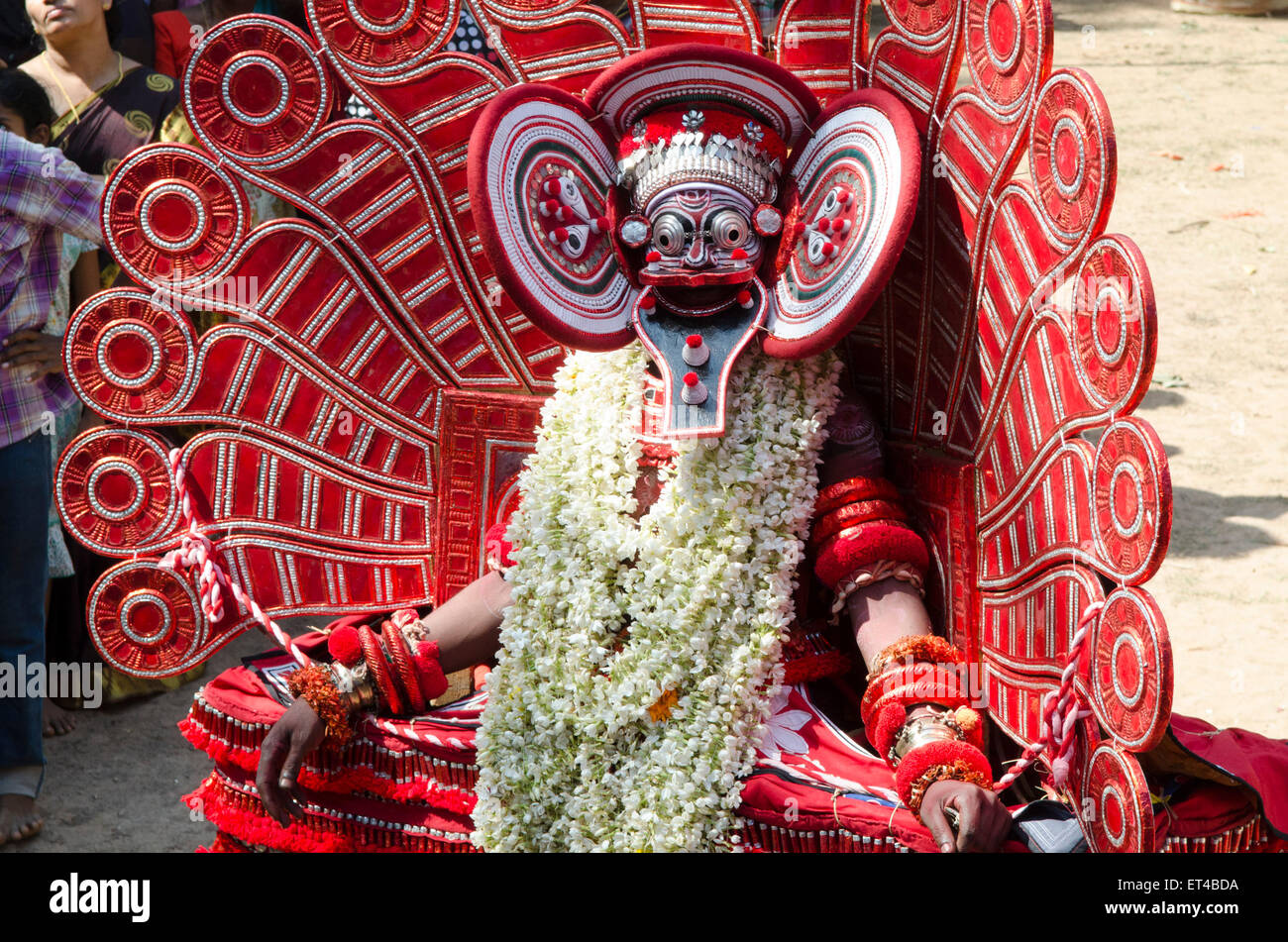 A dancer performs whilst in a trance as part of the ancient tradition of Thayam from Malabar in northern Kerrala Stock Photo