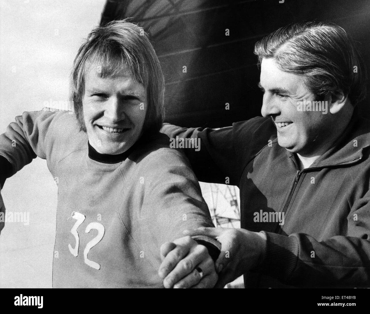 Jack Hatfield, owner of Sports Shop, Jack Hatfield Sports, Middlesbrough, giving Broro's goal ace John Hickton some swimming tips, before he takes to the water, for charity, 10th February 1972. Stock Photo