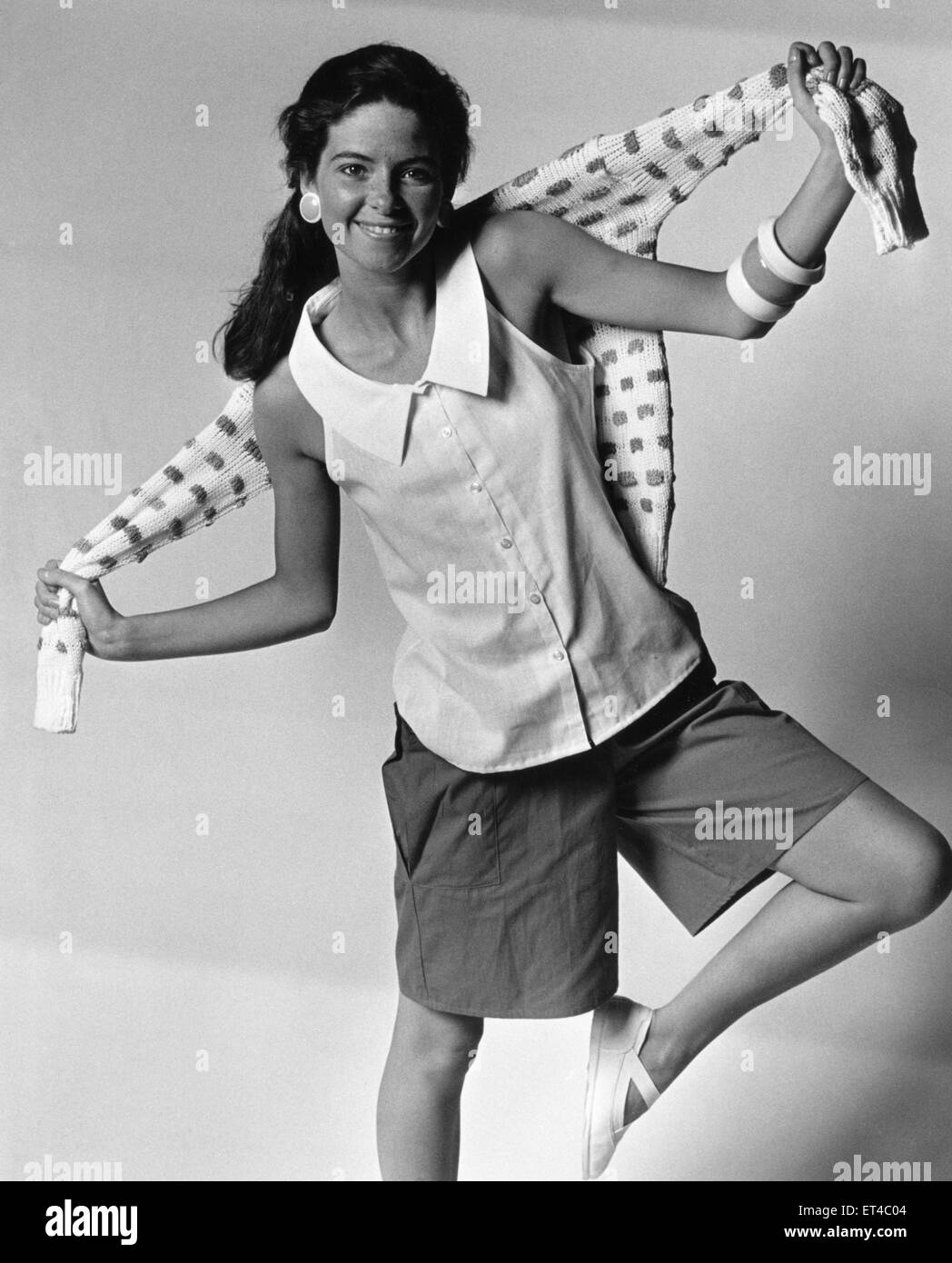 1980s Women,s Fashion: Our model wears shorts sleeveless blouses and a pattern jumper 6th May 1985 Stock Photo