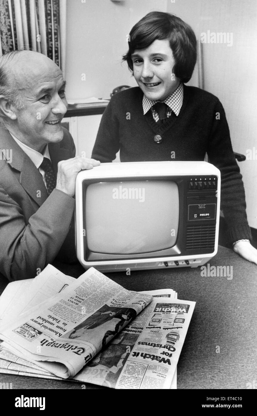 Chris Tait has won the North-East final of the Newsboy or Girl of the Year competition.  The 15-year-old Dunston lad was chosen from 19 boys and girls to represent the region in the London final in January, when he stands a chance of a visit to the Moscow Olympics. He was presented with a portable Television set by Newcastle Chronicle and Journal Ltd. general circulation manager Mr. Geoff Clark. 10th December 1979. Stock Photo