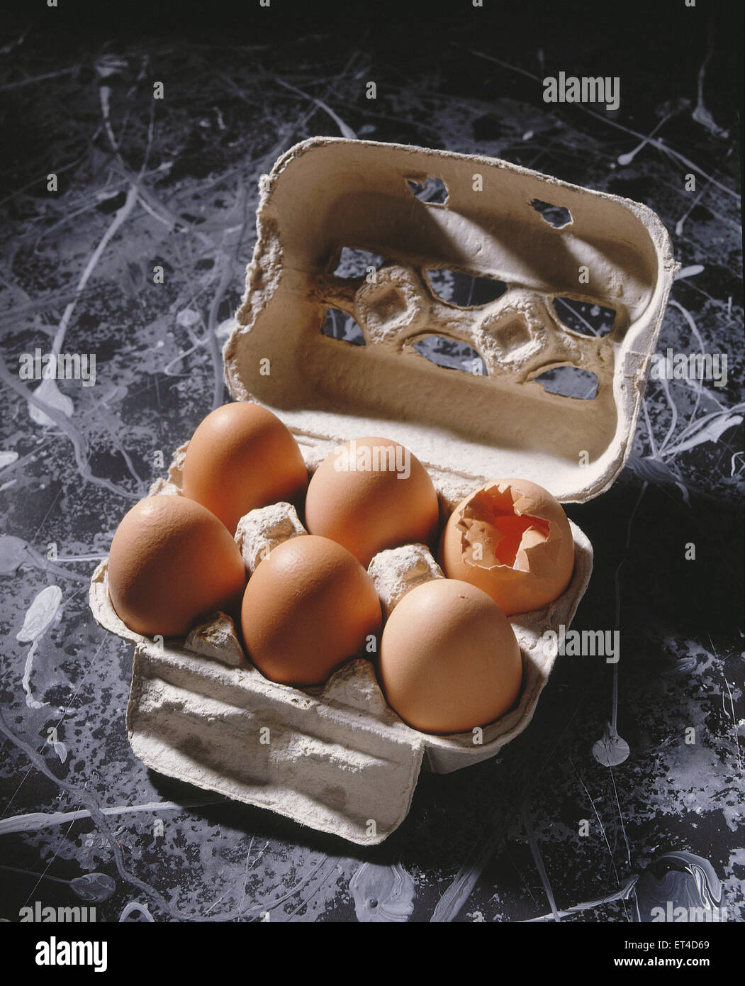 Hamburg, Germany, egg carton with broken egg Stock Photo Alamy