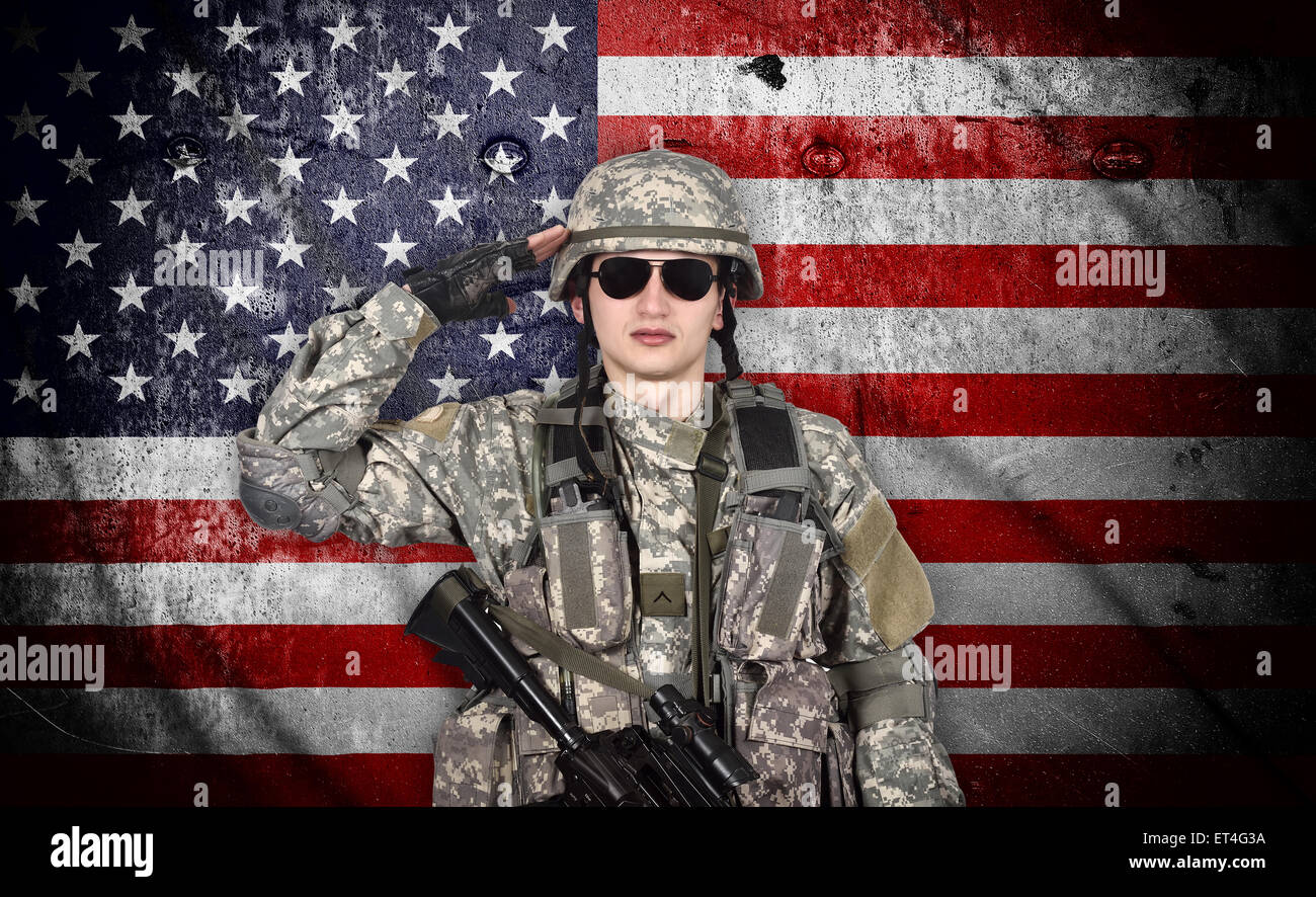 soldier salutes the American flag on the background Stock Photo - Alamy