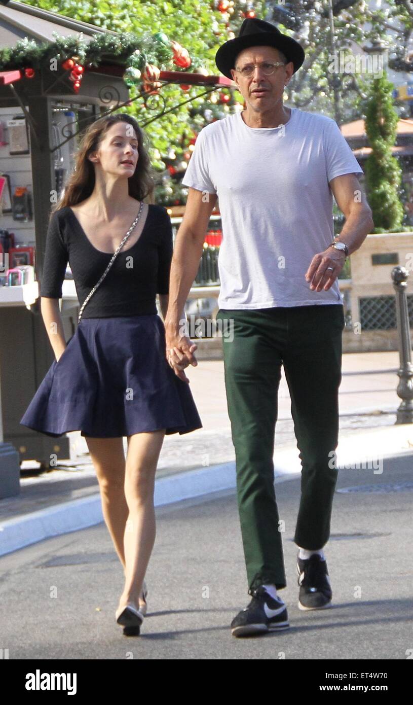 Jeff Goldblum holding hands with his wife Emilie Livingston as