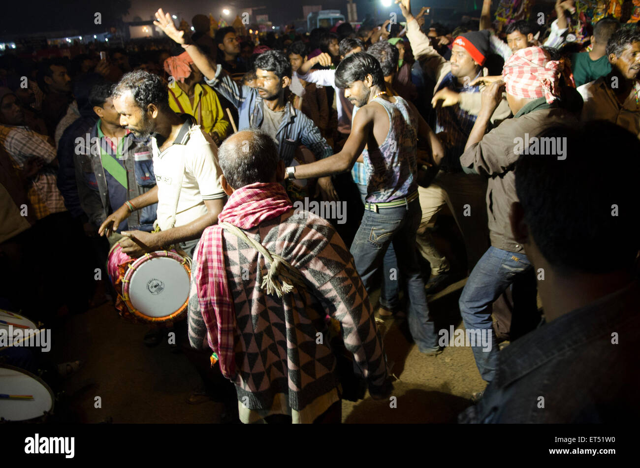 revellers dance through the night at Maga Sapthami sun festival in Konark, Odish state, India. the largest festival in Odisha Stock Photo
