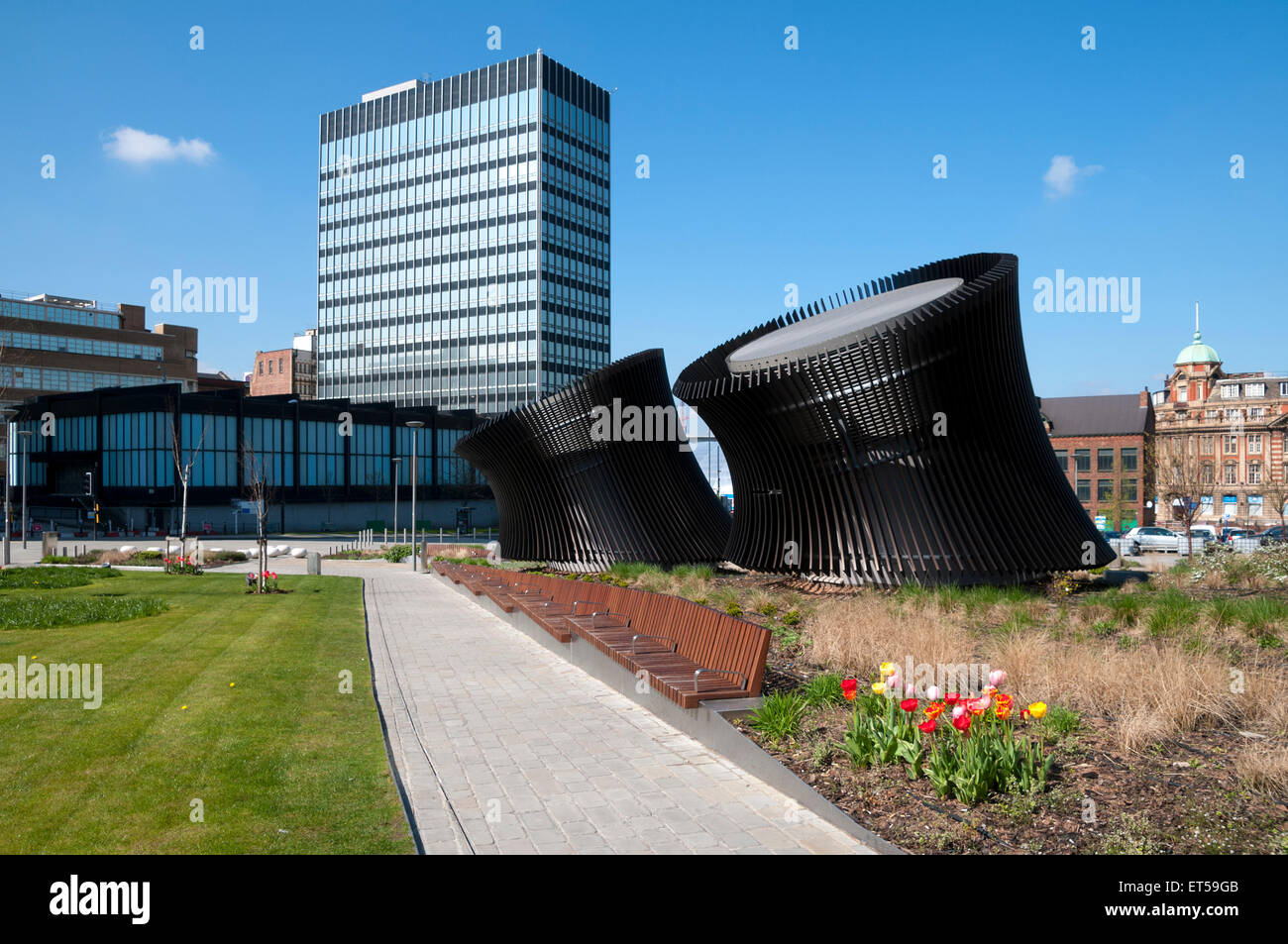 New Century House from Angel Square, Manchester, UK.  The objects in the foreground are for a heating and ventilation system. Stock Photo