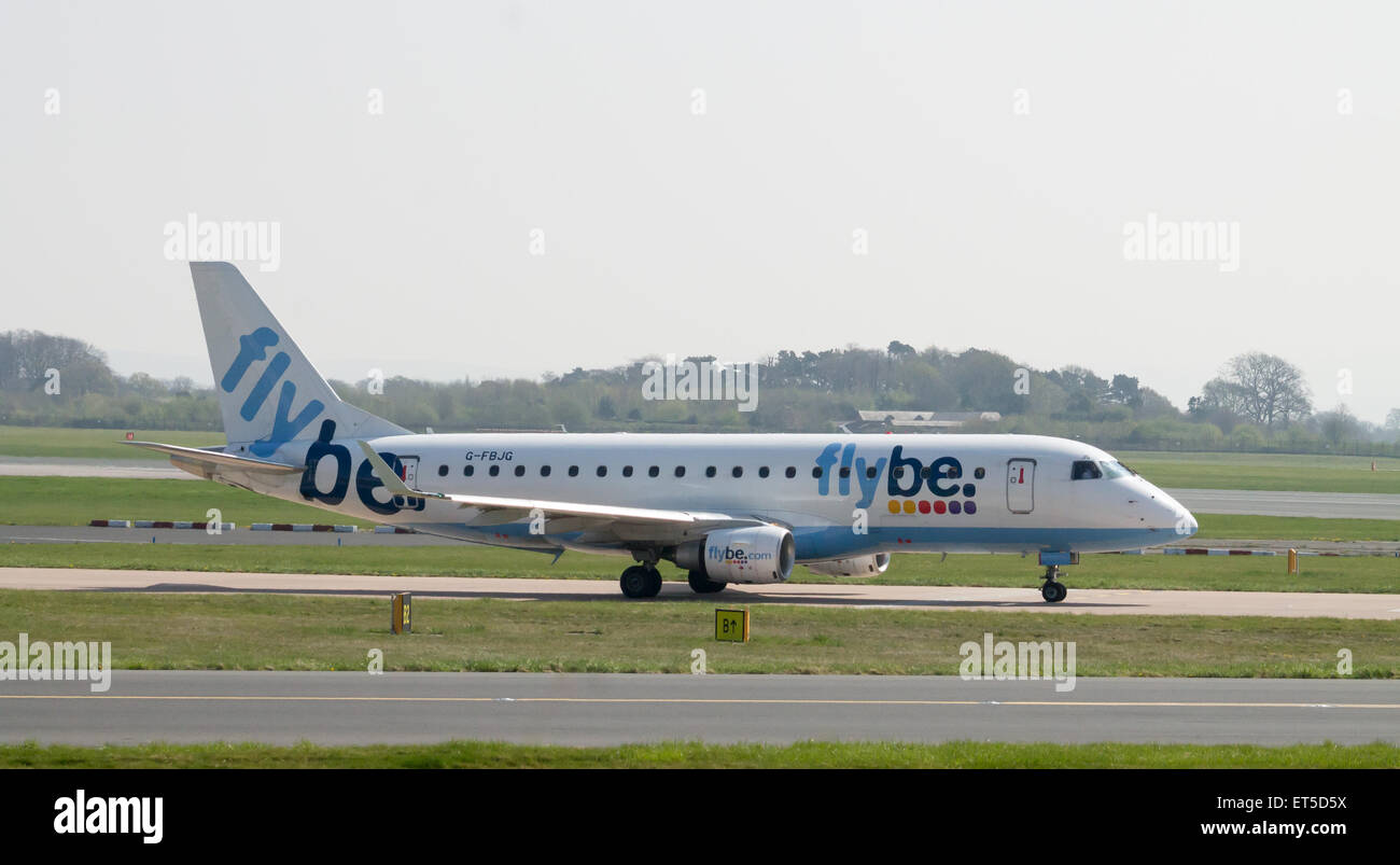 Flybe Embraer ERJ-175 (G-FBJB) taxiing on Manchester International Airport taxiway. Stock Photo