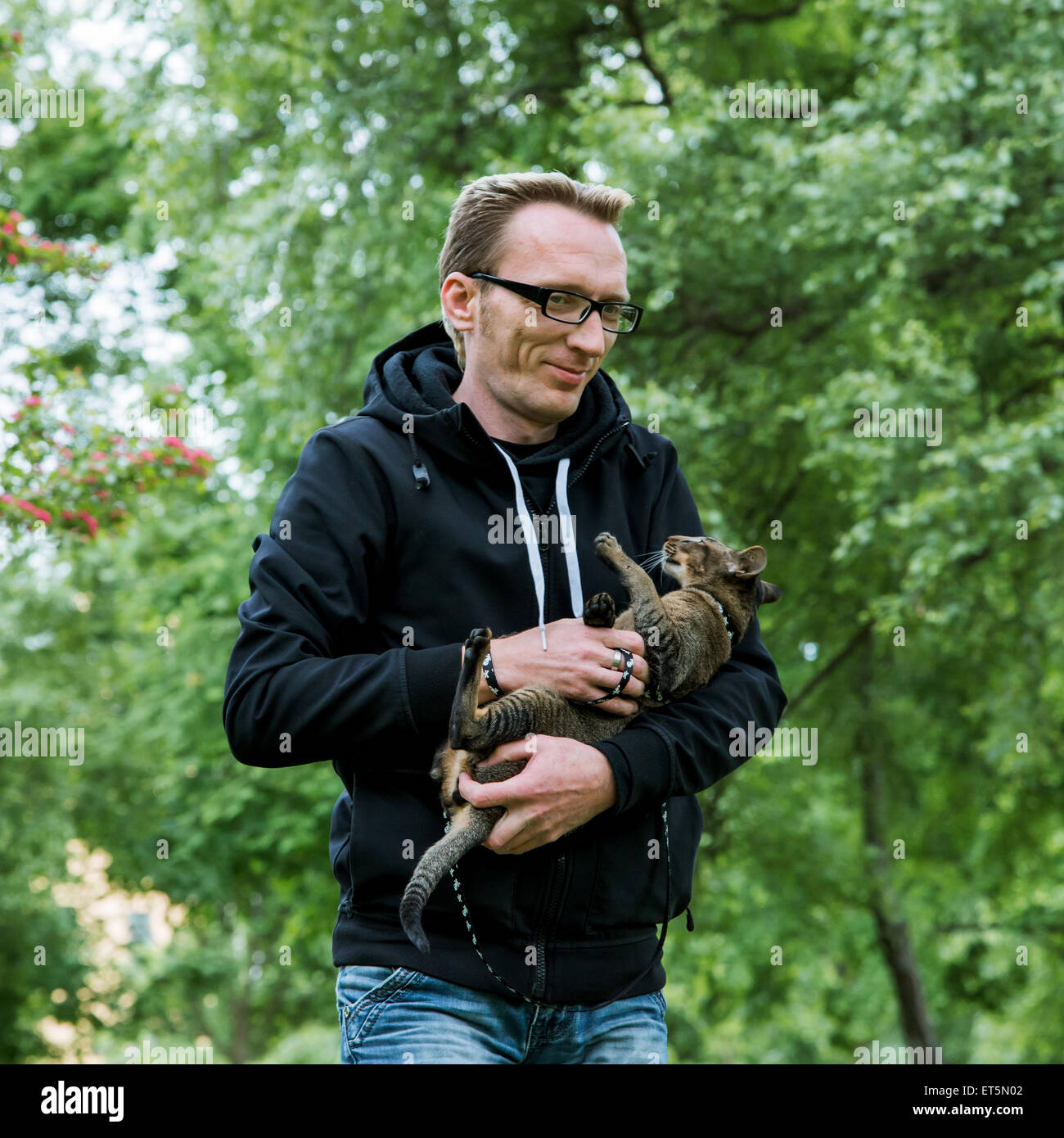 portrait smiling man with his cat Stock Photo - Alamy