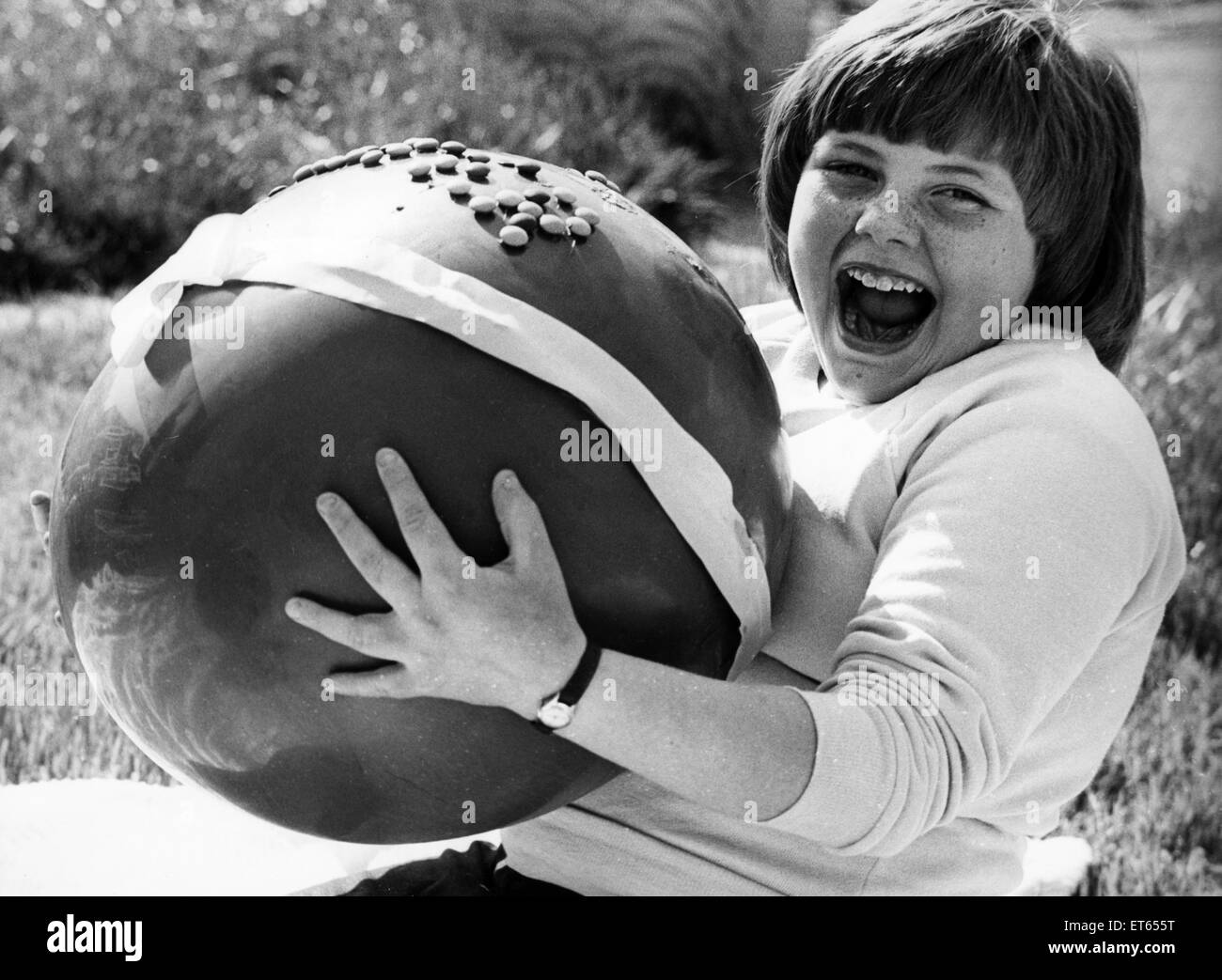 Lynn McGiven, pictured with her enormous prize, a large chocolate easter egg, after winning an Easter Card Colouring Competition, 18th April 1981. Stock Photo