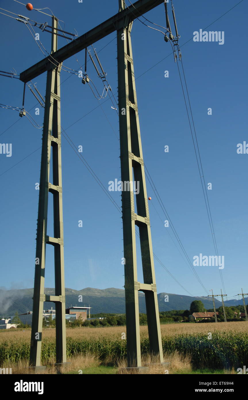 Structures holding up electrical lines in rural Switzerland Stock Photo