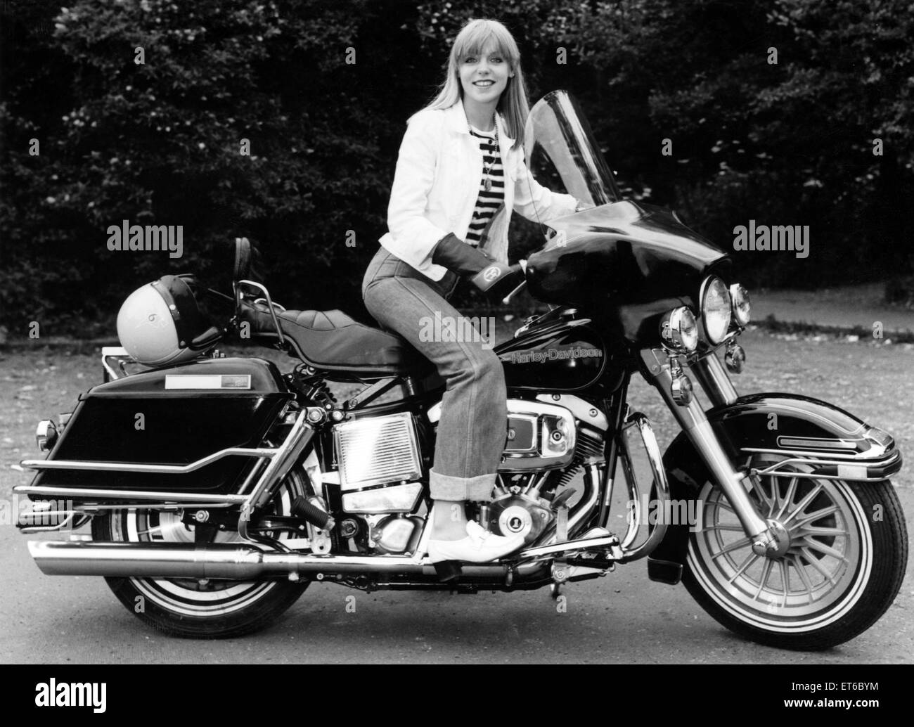 Motorcyclist Jane Donovan tries the massive 1350cc Harley-Davidson Electra Glide. Retailing at £3,999, the Harley was the most expensive production motorcycle on display at the recent Earls Court International Motor Cycle Show. 5th September 1978. Stock Photo