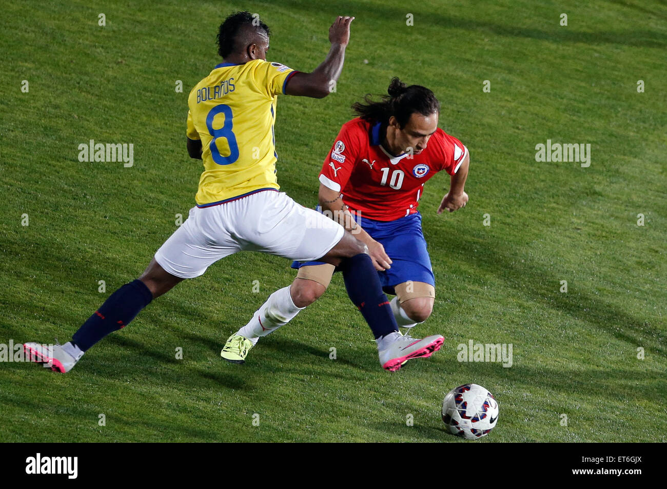 Santiago, Chile. 11th June, 2015. Jorge Valdivia (R) of Chile vies for the ball with Miller Bolanos (L) from Ecuador during the opening match of the Copa America 2015, in Santiago, capital of Chile, on June 11, 2015. Chile won 1-0. Credit:  Jorge Villegas/Xinhua/Alamy Live News Stock Photo