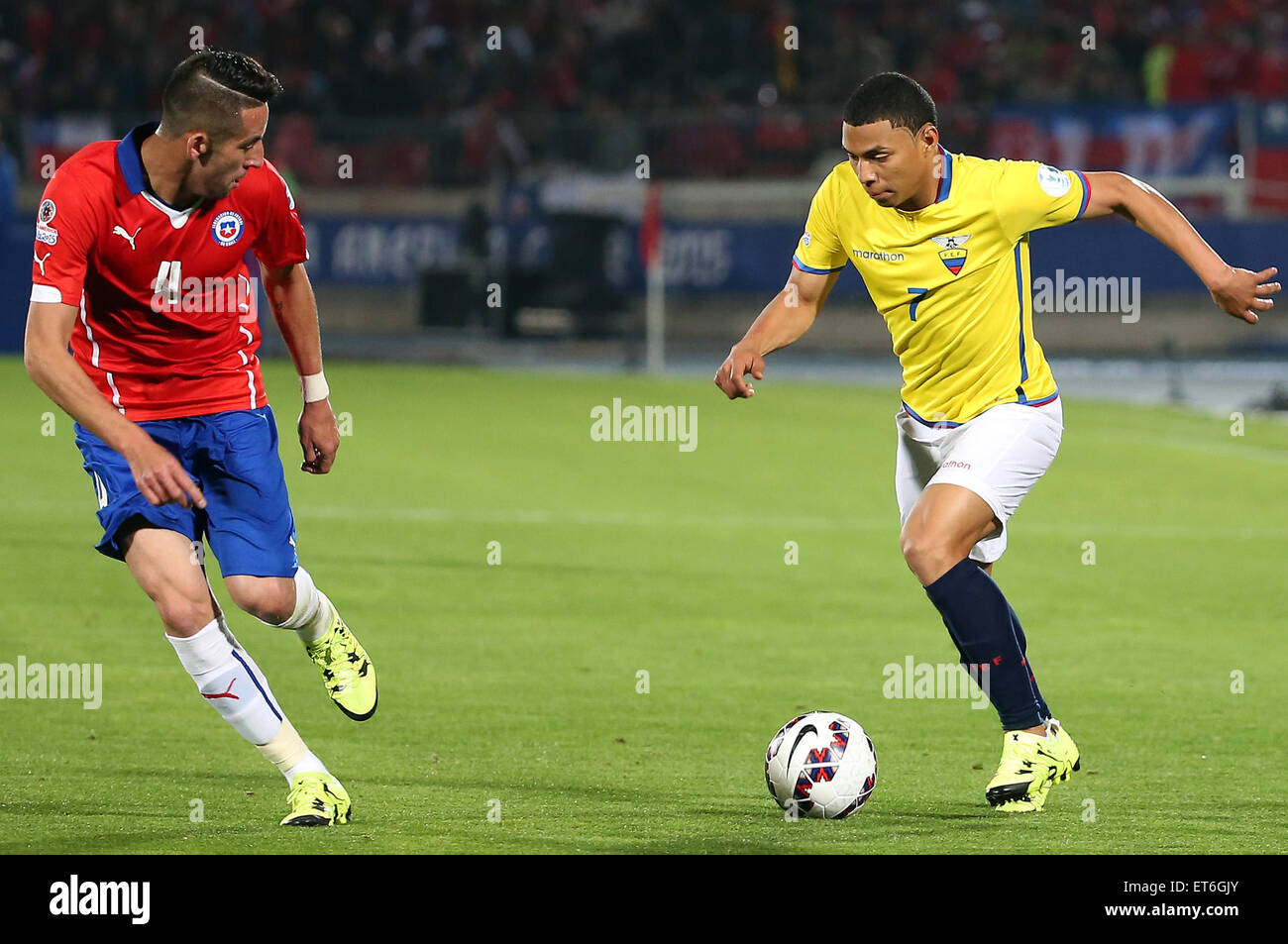 Santiago, Chile. 11th June, 2015. Mauricio Isla (L) of Chile vies for the ball with Jefferson Montero (R) from Ecuador during the opening match of the Copa America 2015, in Santiago, capital of Chile, on June 11, 2015. Chile won 1-0. Credit:  Xu Zijian/Xinhua/Alamy Live News Stock Photo