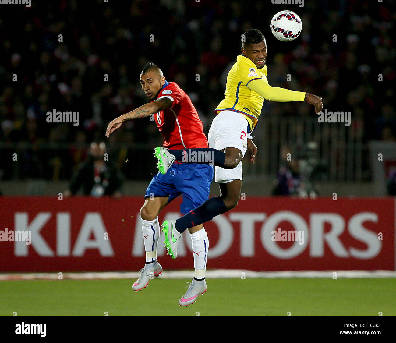Santiago, Chile. 11th June, 2015. Arturo Vidal (L) of Chile vies for the ball with Gabriel Achilier (R) from Ecuador during the opening match of the Copa America 2015, in Santiago, capital of Chile, on June 11, 2015. Chile won 1-0. Credit:  TELAM/Xinhua/Alamy Live News Stock Photo
