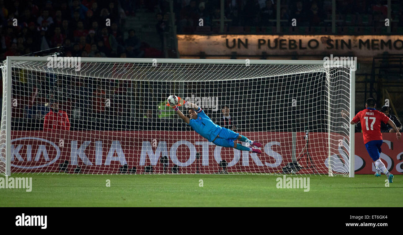 Santiago, Chile. 11th June, 2015. Claudio Bravo (L) of Chile holds the ball during the opening match of the Copa America 2015 against Ecuador, in Santiago, capital of Chile, on June 11, 2015. Chile won 1-0. Credit:  Guillermo Arias/Xinhua/Alamy Live News Stock Photo