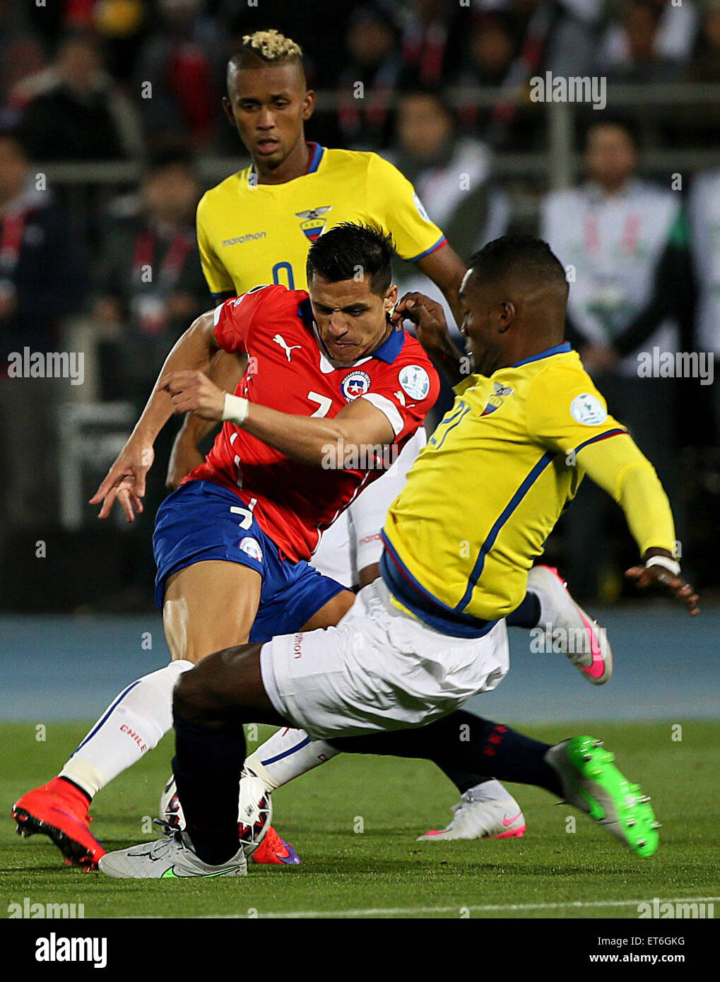 Santiago, Chile. 11th June, 2015. Alexis Sanchez (C) of Chile vies for the ball with Gabriel Achilier (R) from Ecuador during the opening match of the Copa America 2015, in Santiago, capital of Chile, on June 11, 2015. Credit:  TELAM/Xinhua/Alamy Live News Stock Photo