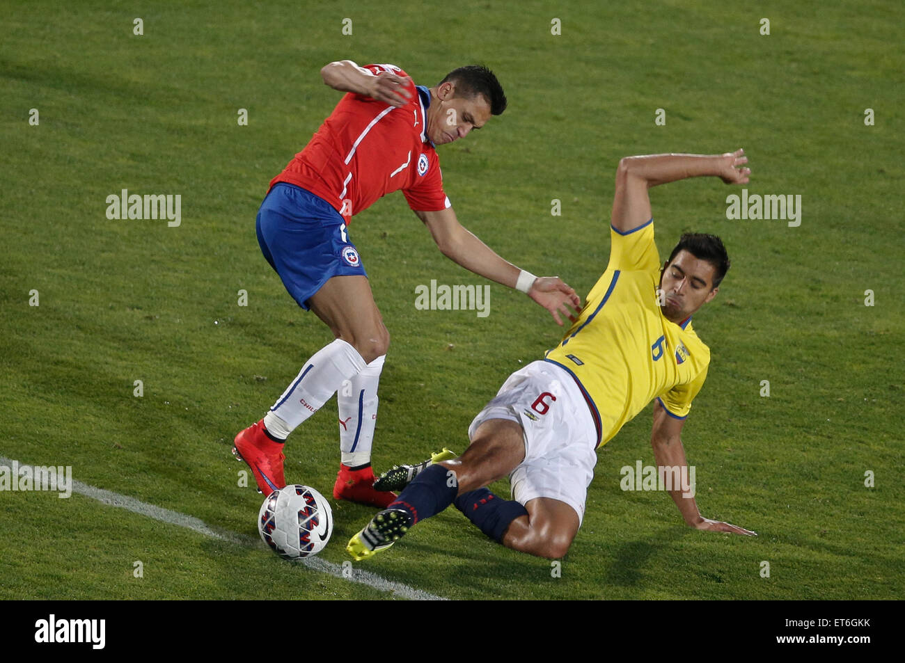 Santiago, Chile. 11th June, 2015. Alexis Sanchez (L) of Chile vies for the ball with Christian Noboa (R) from Ecuador during the opening match of the Copa America 2015, in Santiago, capital of Chile, on June 11, 2015. Chile won 1-0. Credit:  Jorge Villegas/Xinhua/Alamy Live News Stock Photo