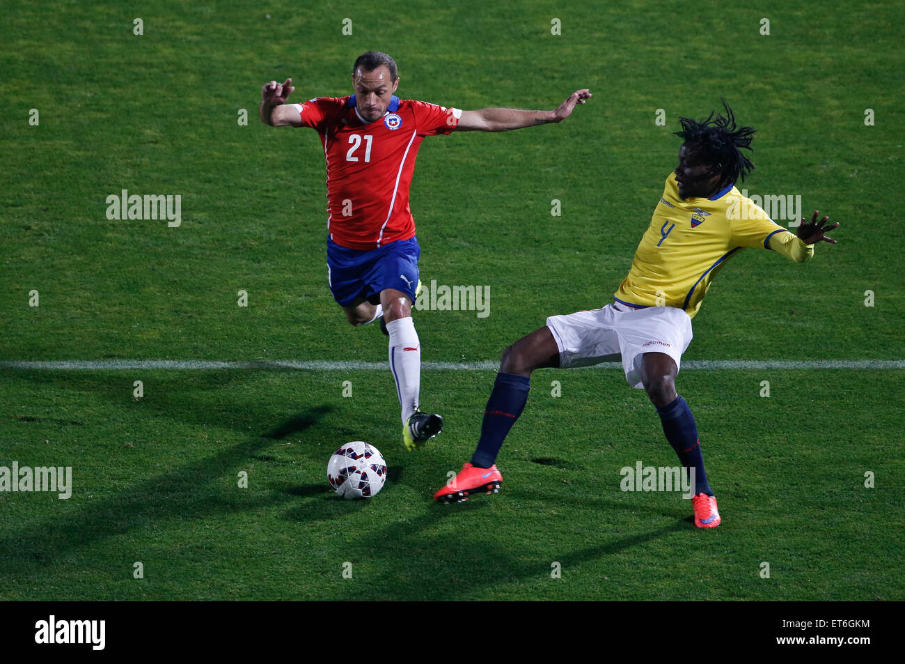 Santiago, Chile. 11th June, 2015. Marcelo Diaz (L) from Chile vies for the ball with Juan Paredes (R) from Ecuador during the opening match of the Copa America 2015, in Santiago, capital of Chile, on June 11, 2015. Chile won 1-0. Credit:  Jorge Villegas/Xinhua/Alamy Live News Stock Photo