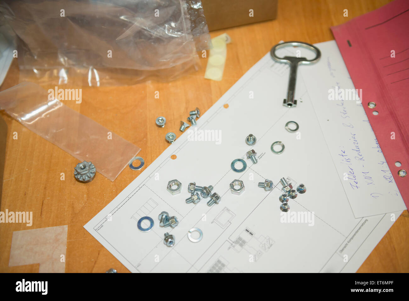 Nuts with bolts and washers on blueprint, Munich, Bavaria, Germany Stock Photo