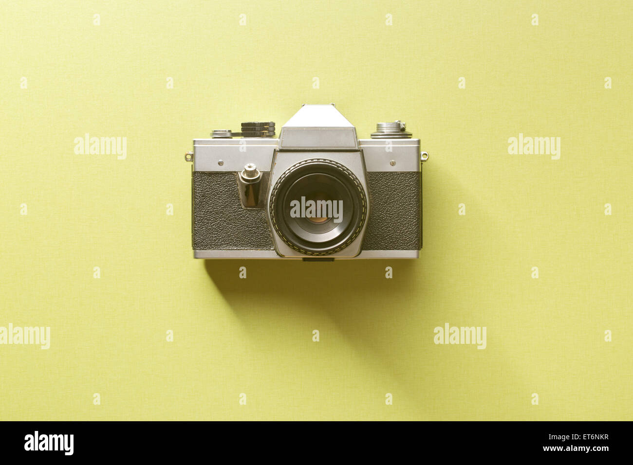 the retro camera on colored background Stock Photo