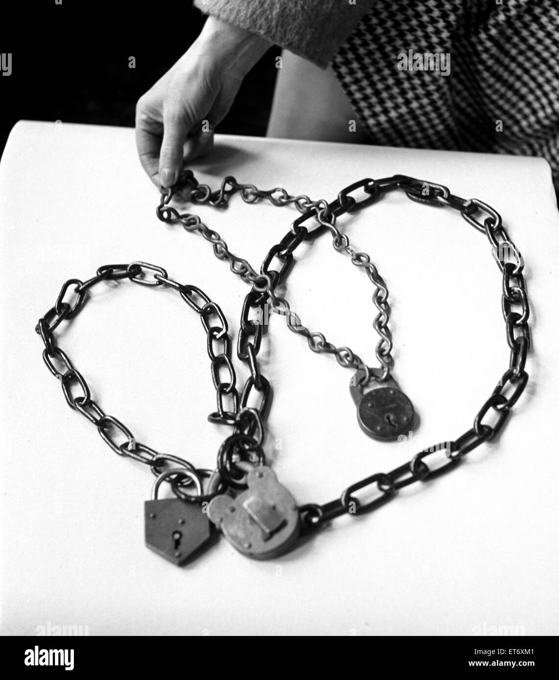Militant equipment used by women Suffragettes during their campaign for the right to vote. Seen in a museum in South Kensington, London. Pictured are chains and padlocks used by Suffragettes to chain themselves to the Downing Street rails.  19th February Stock Photo
