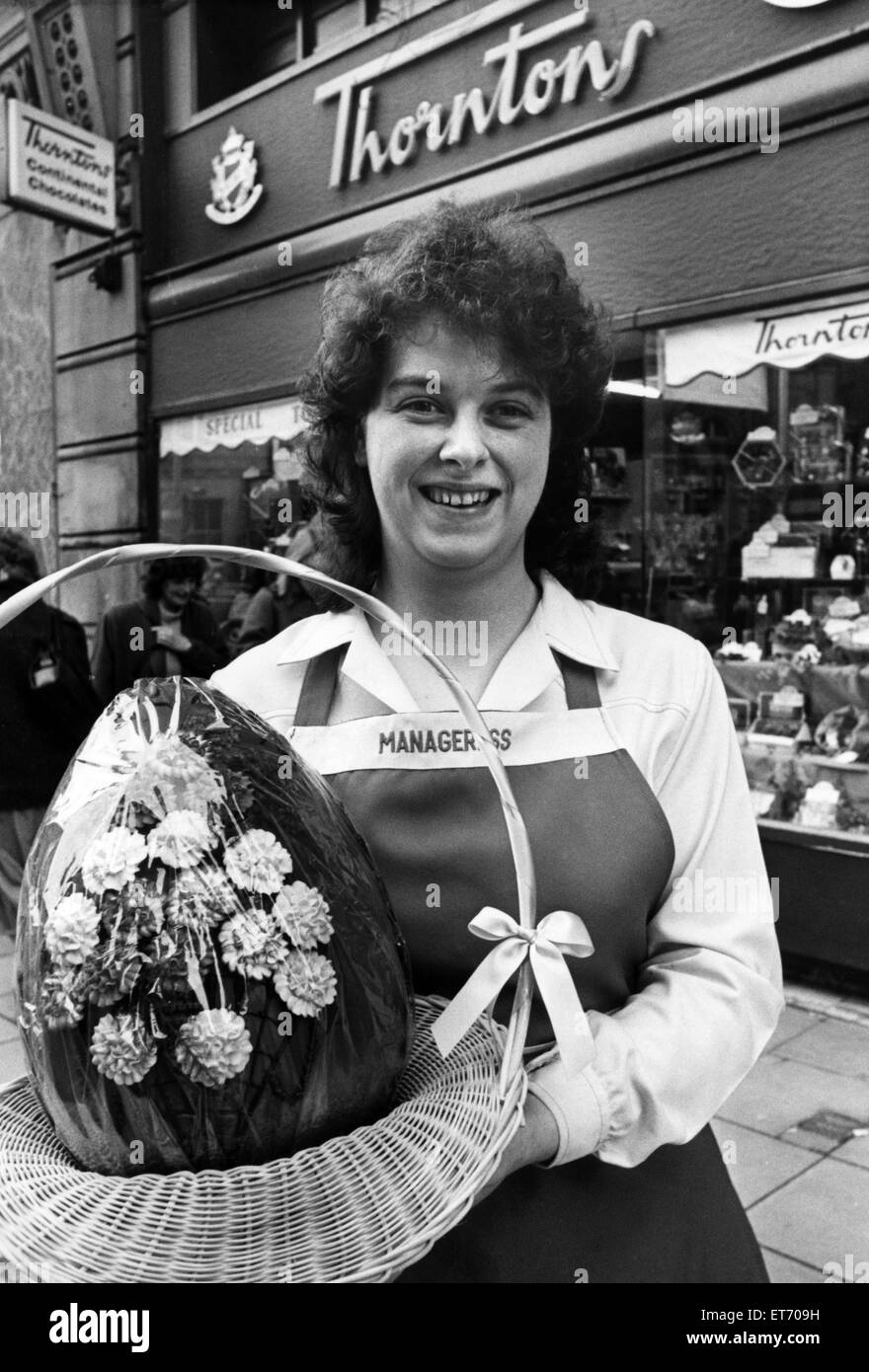 Eggstravagance? Rosalyn Beck, Thorntons Manageress, gets her hands - but not her mouth - on a 32 pound easter egg, 9th April 1987. Stock Photo