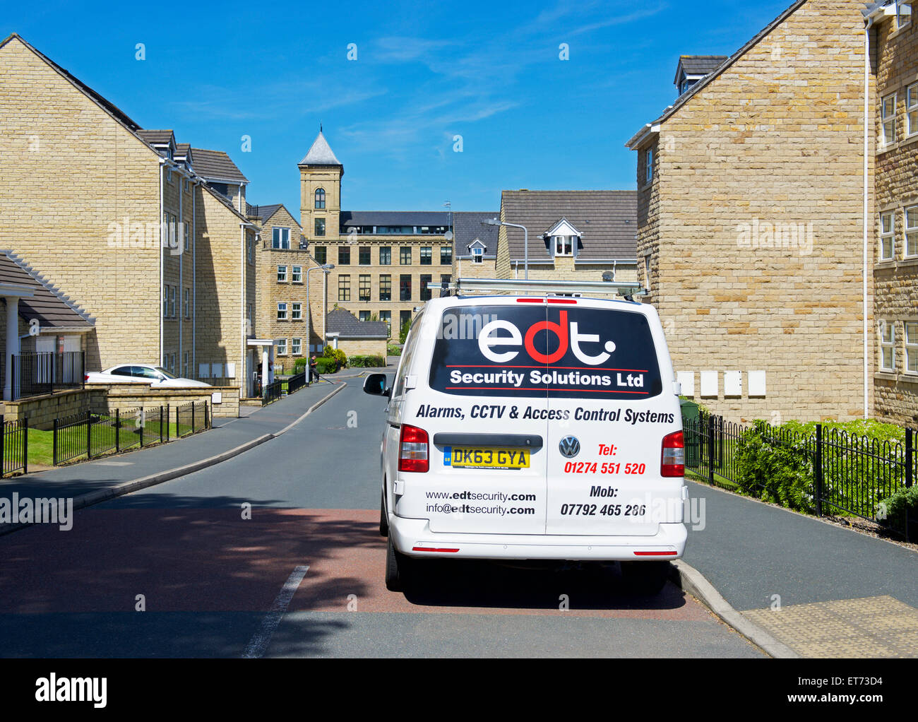 Men installing alarms on properties in Apperley Bridge, near Bradford, West Yorkshire, England UK Stock Photo