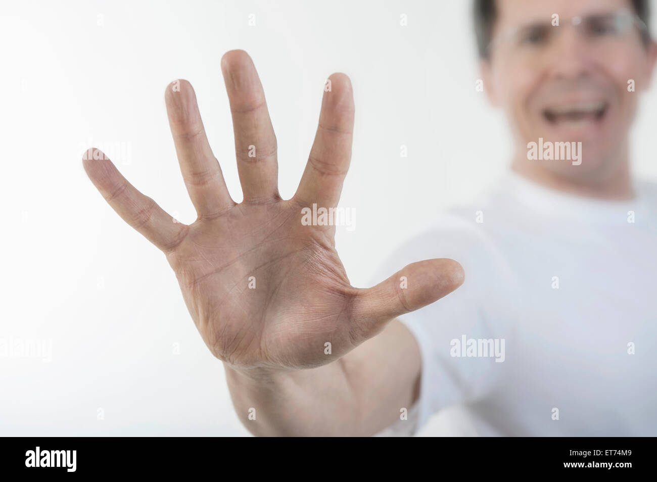 Close-up of man's hand making stop gesture, Bavaria, Germany Stock Photo